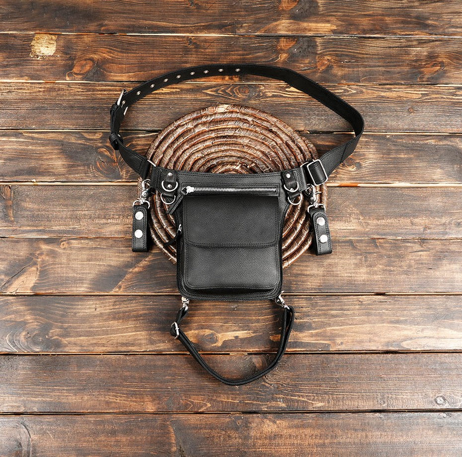 Black leather holster waist belt bag with adjustable straps and metal studs