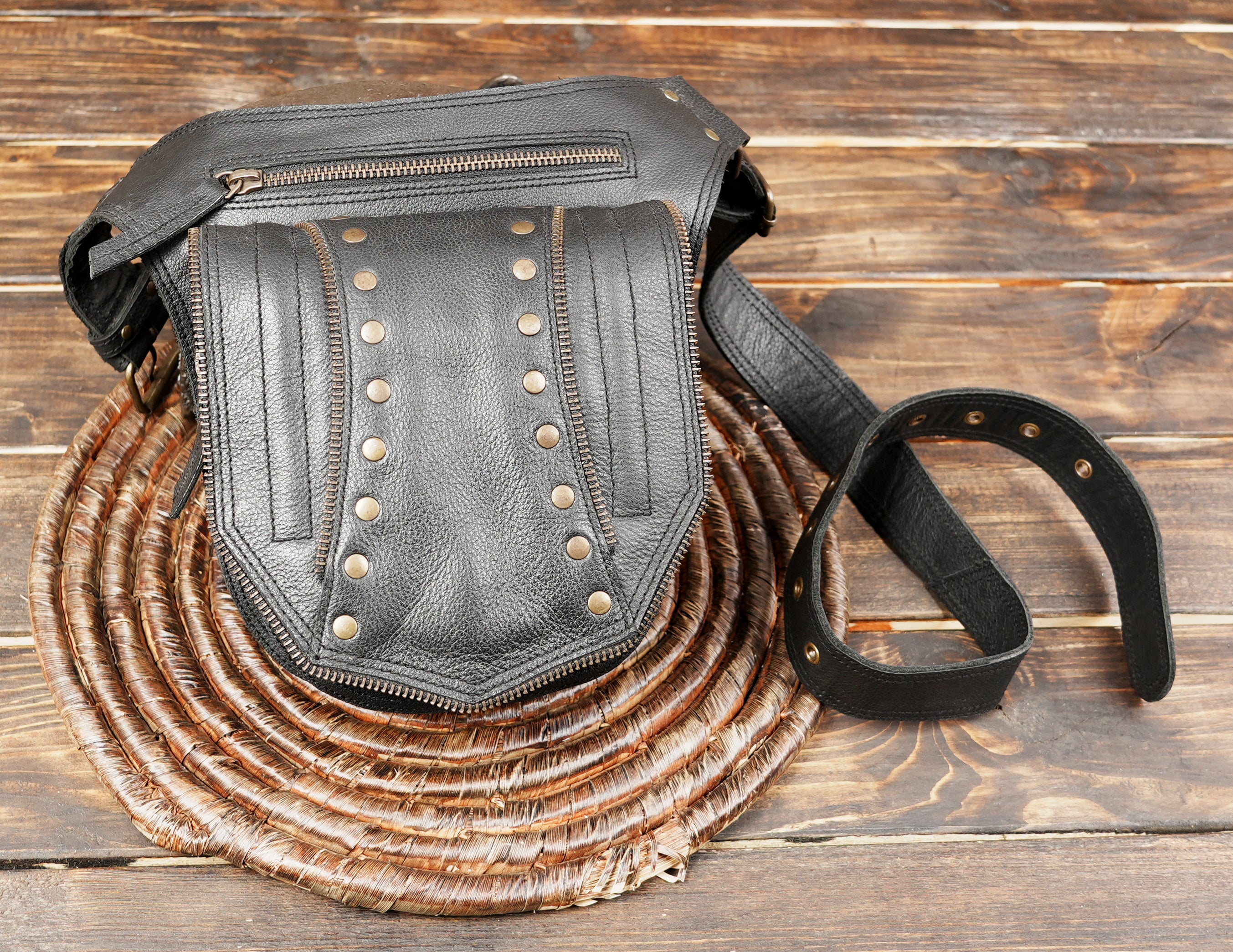 Black steampunk-style waist pack with antique brass hardware
