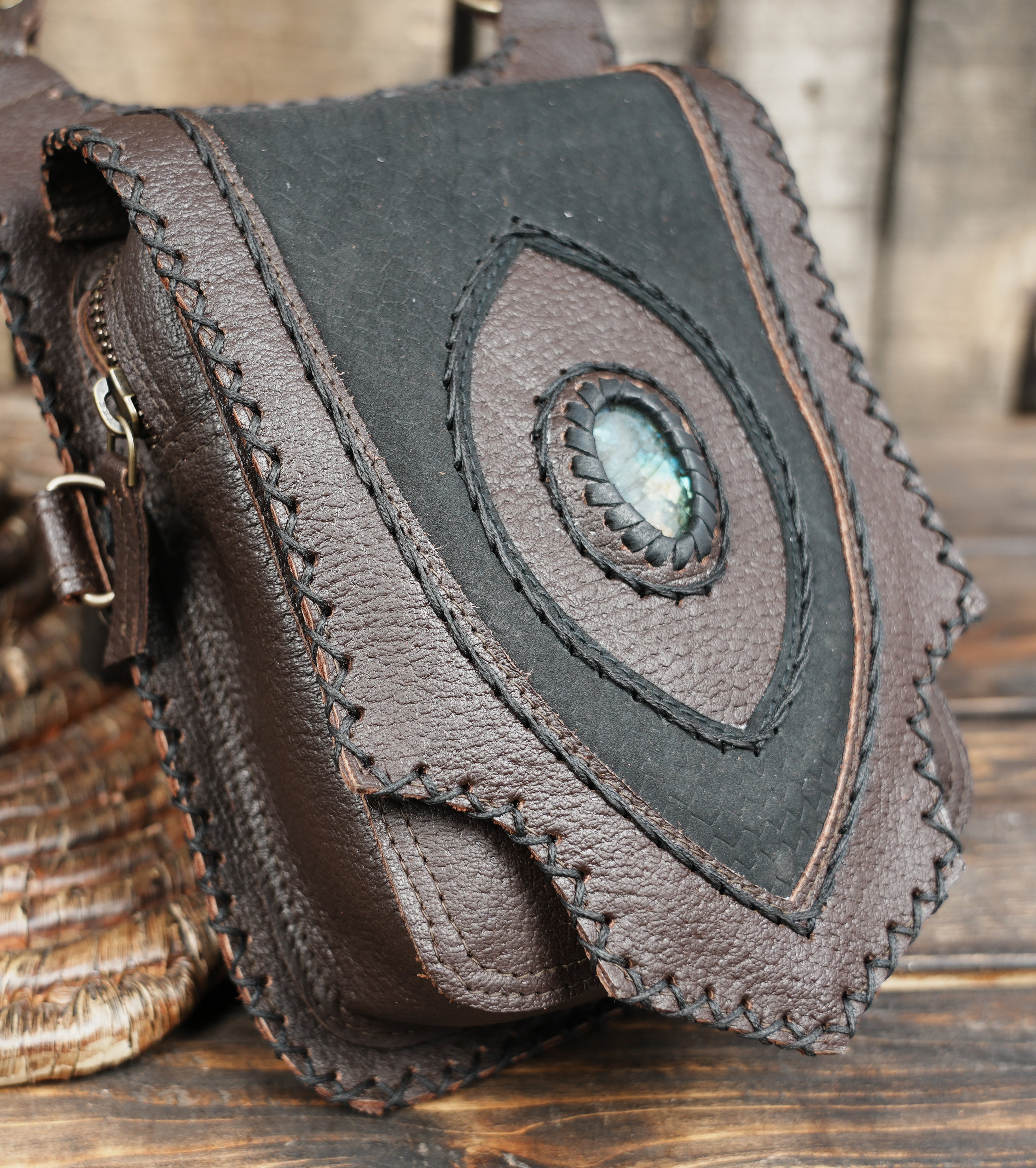 Steampunk inspired leather harness holster with braided stone centerpiece