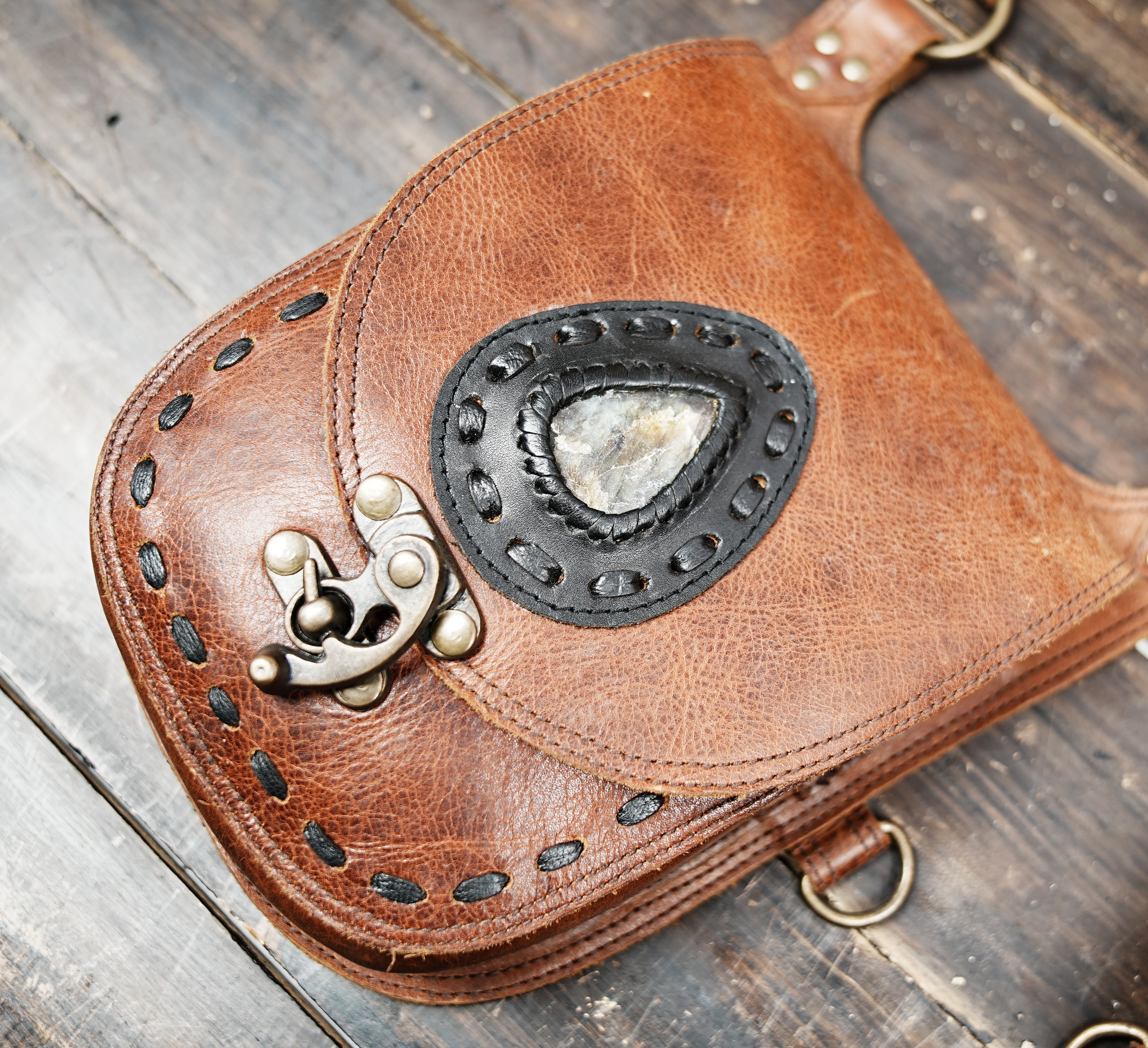 Front view of handmade gemstone leather bag with steampunk Western style