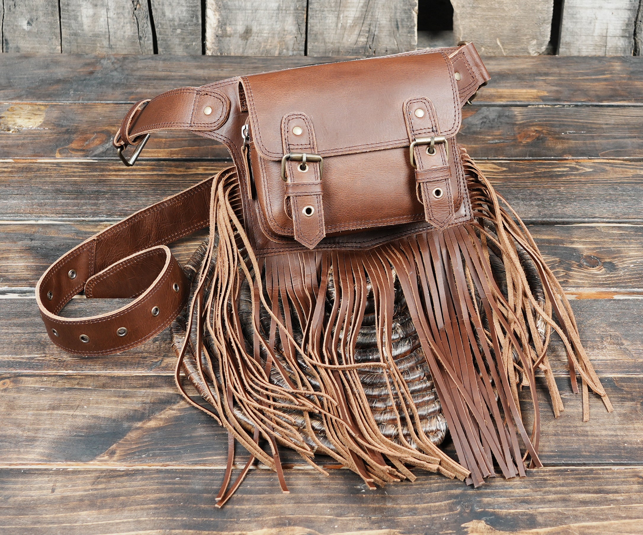 Steampunk western leather hip bag with brass buckles and fringe