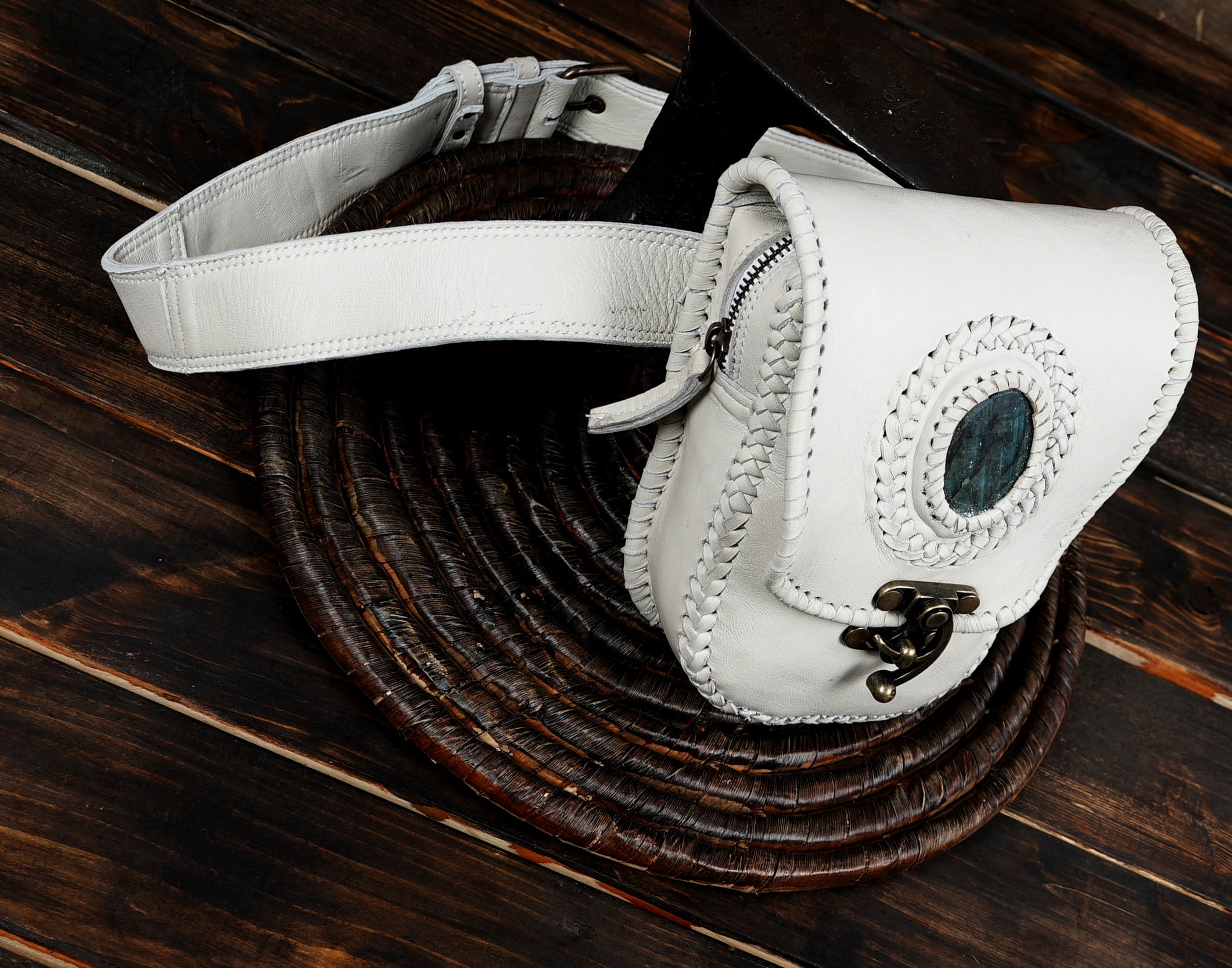 Handmade leather waist belt pouch featuring a blue stone centerpiece