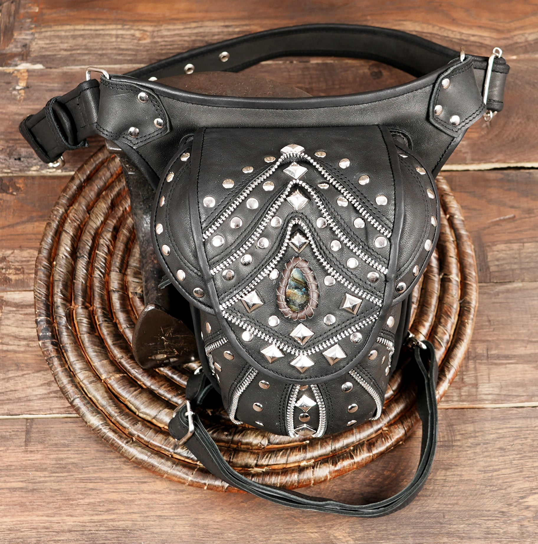 Hand-stitched black leather utility bag with gemstone accent with stone and star 