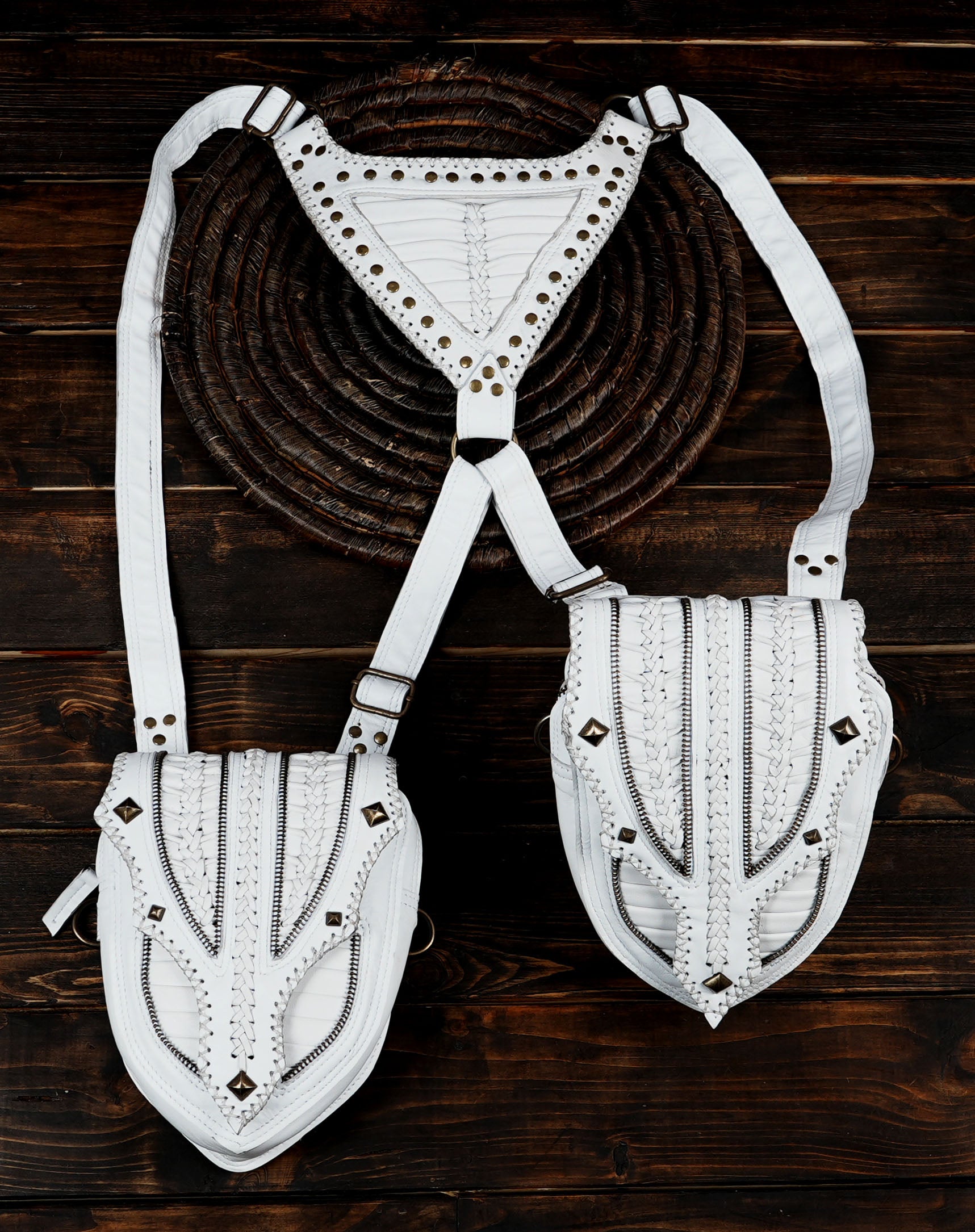 Dual pocket white leather harness bag with metal accents