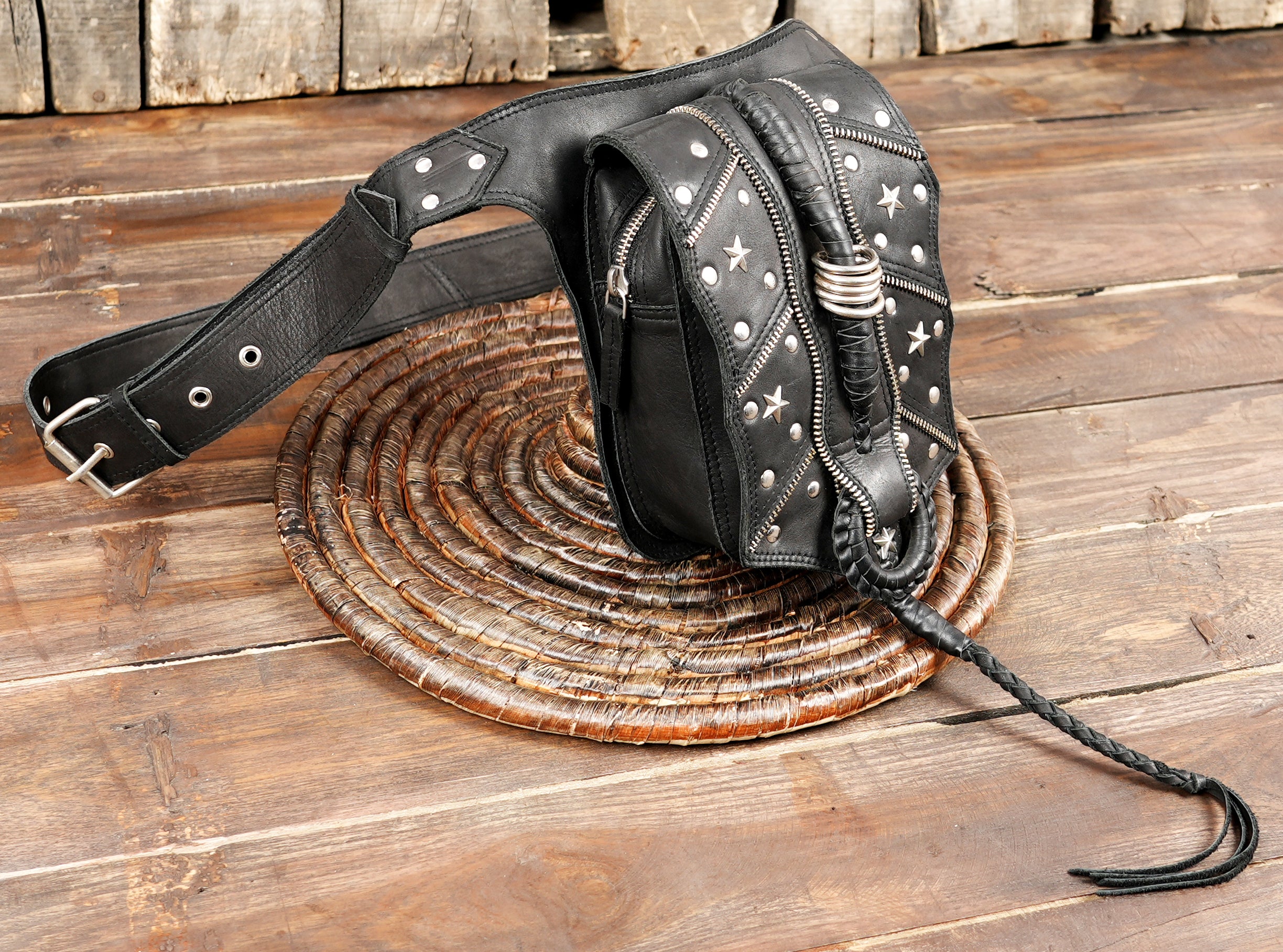 Artisan handmade black leather hip bag with metal accents