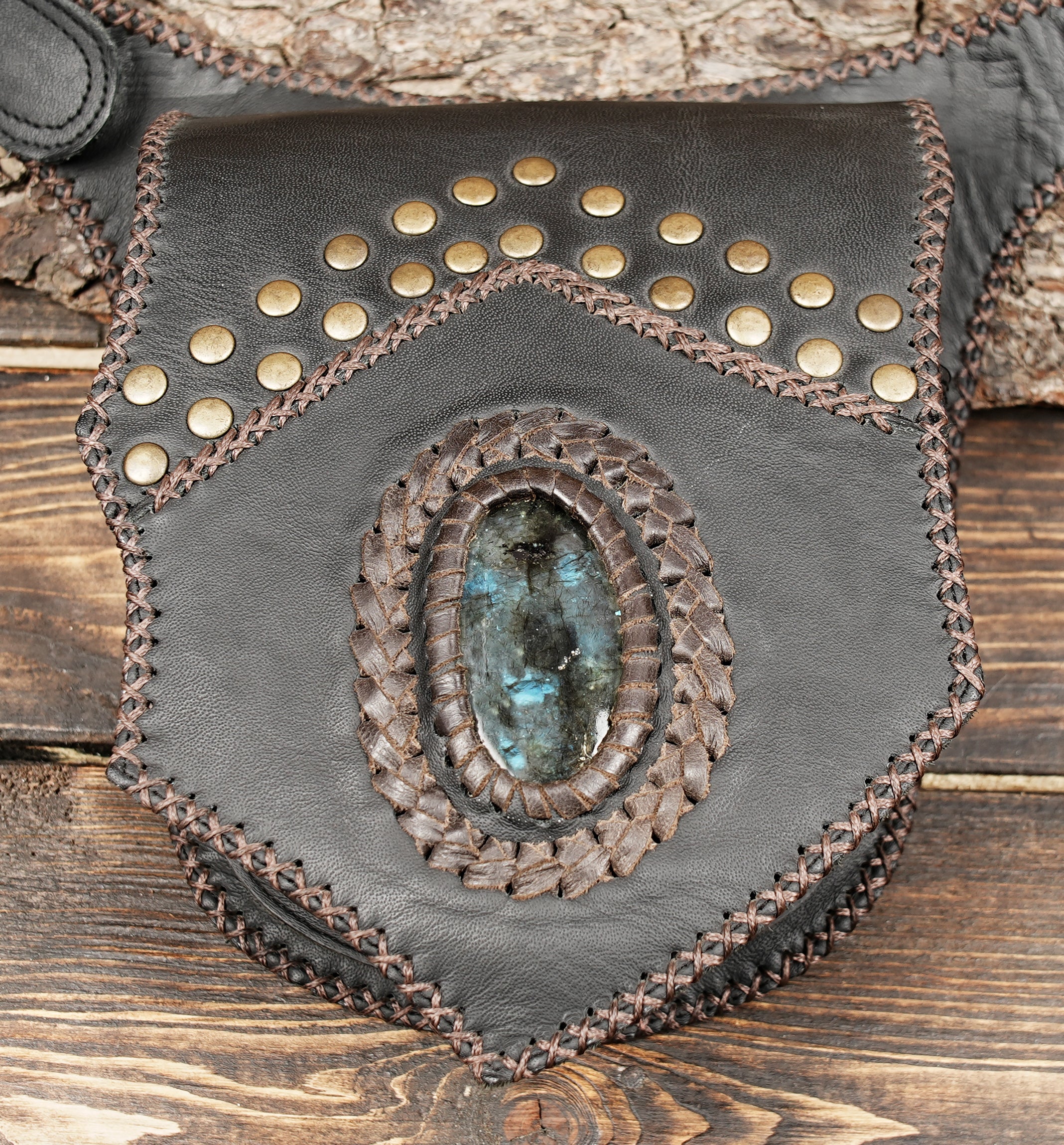 Western-style hip bag with handcrafted stitching and rivets