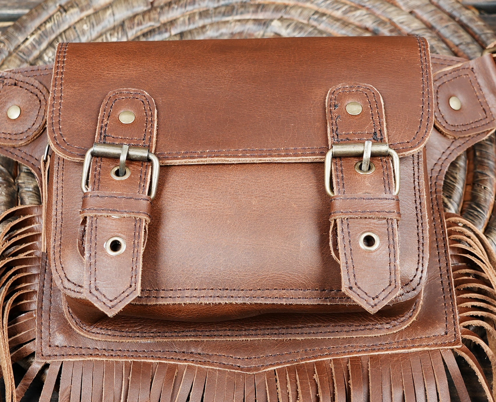 Rustic leather festival belt with decorative fringe and secure flap