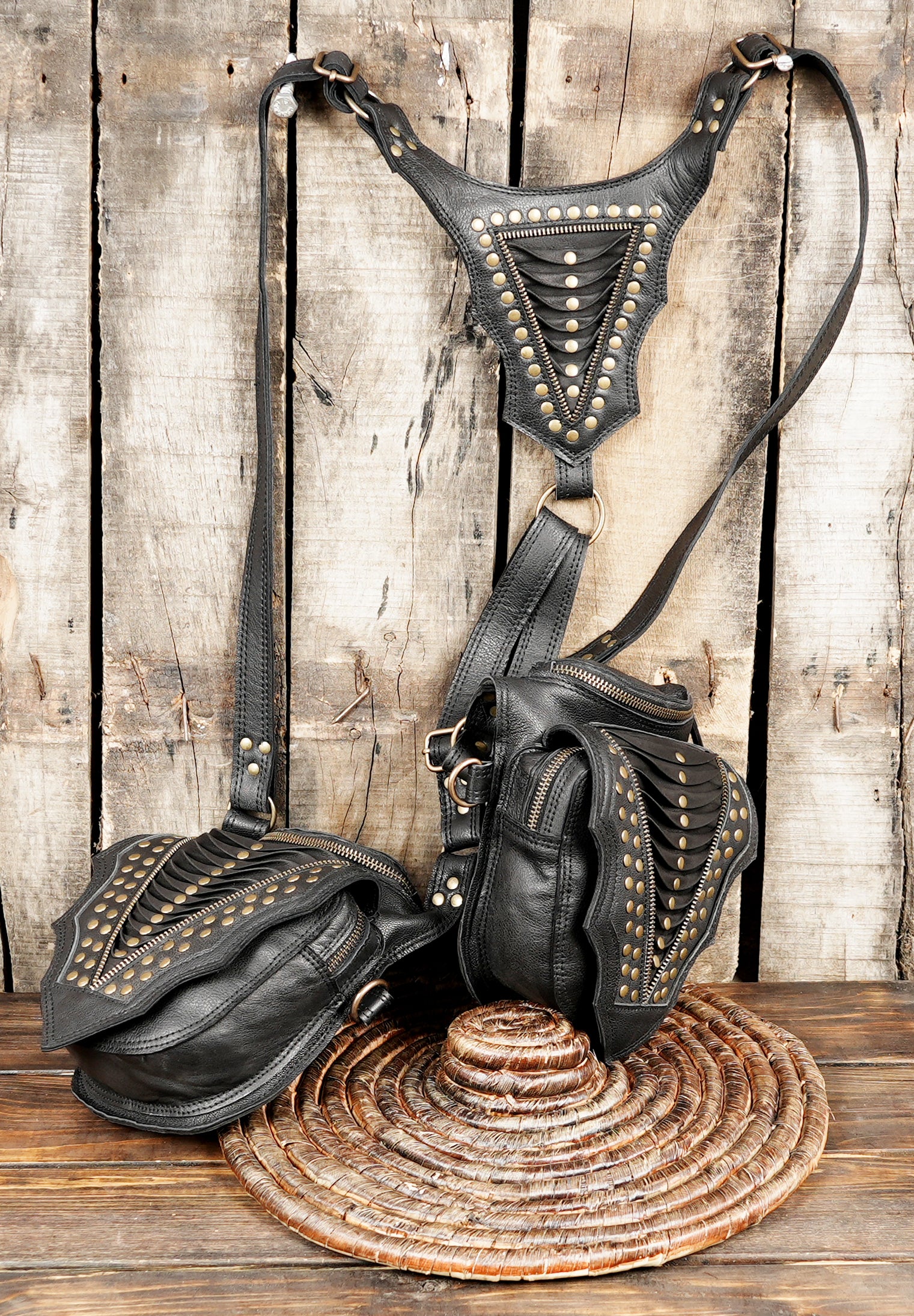 “Handcrafted leather holster set with two pouches and bold stud detailing”