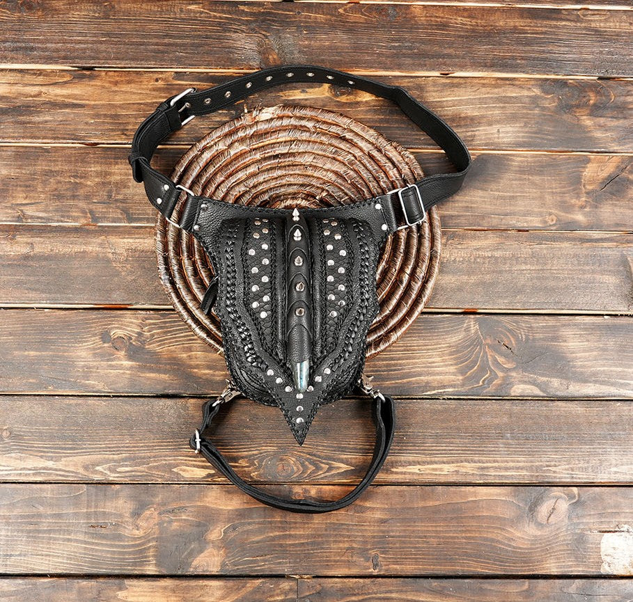 Handcrafted gothic leather leg bag with metal studs and braided detailing