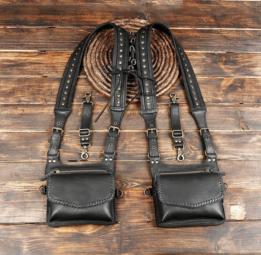 Handmade black leather holster bag with braided flap design and brass details.