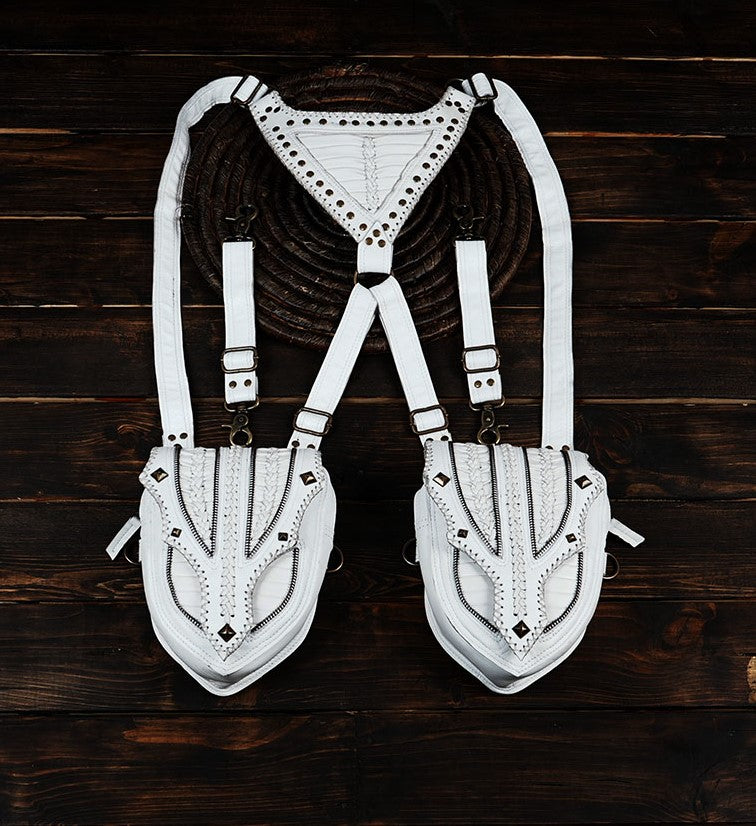 Handmade white leather holster bag with dual pockets on wooden background