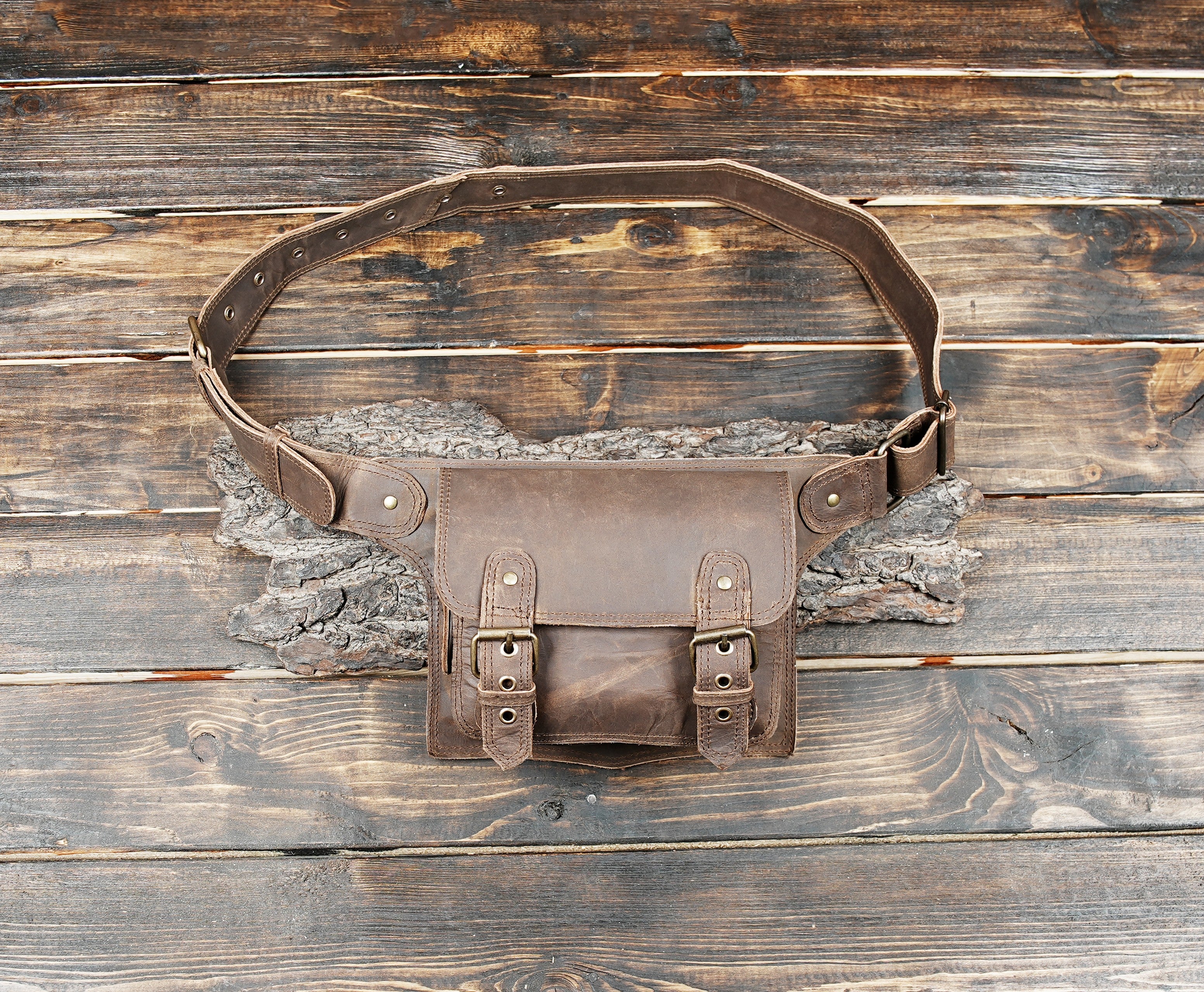 Handmade brown leather waist bag with vintage buckle straps