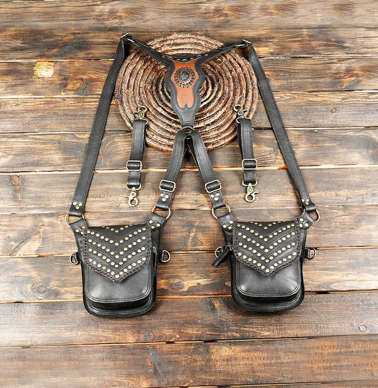 Handcrafted black leather holster bag with brass studded design and gemstone centerpiece.