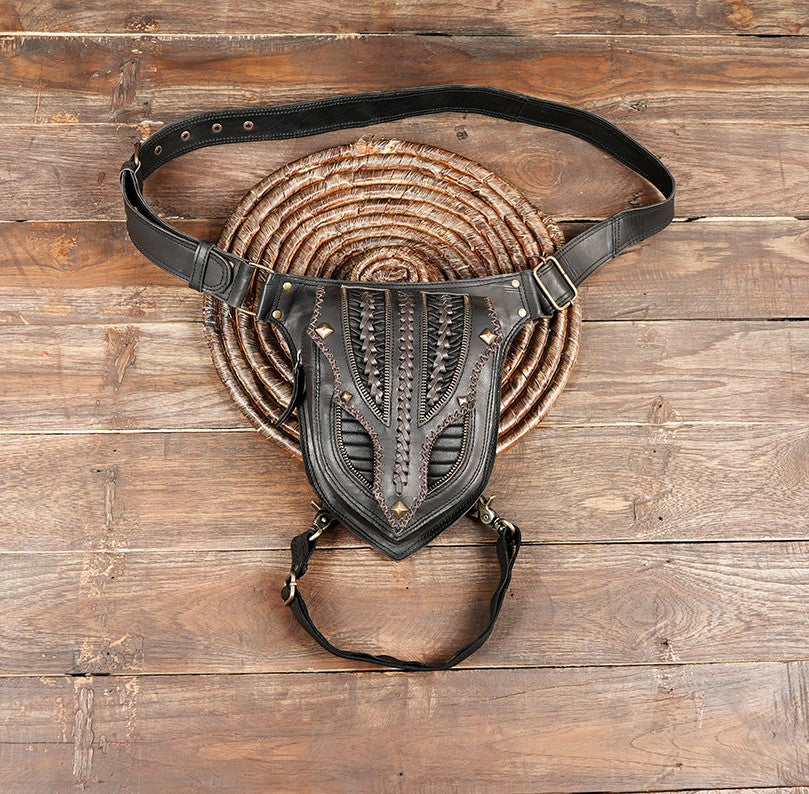 Handmade black leather hip bag with braided detailing and brass studs