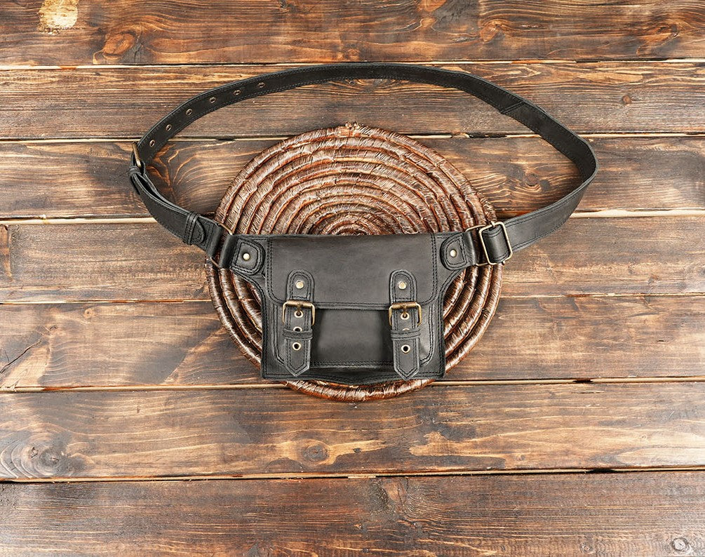 Back view of leather waist bag showing zipper pocket.