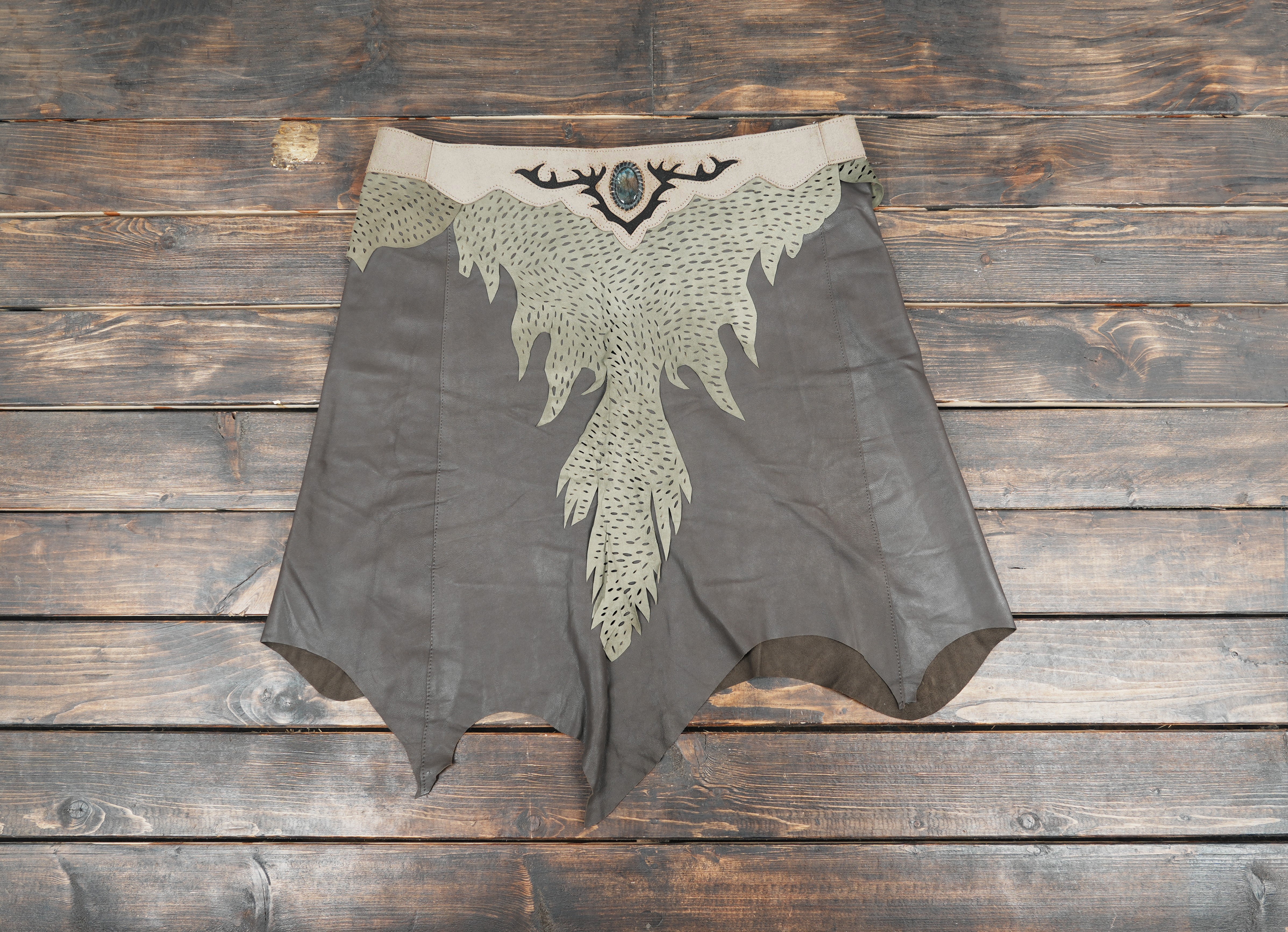 Handcrafted leather skirt with leaf-pattern design