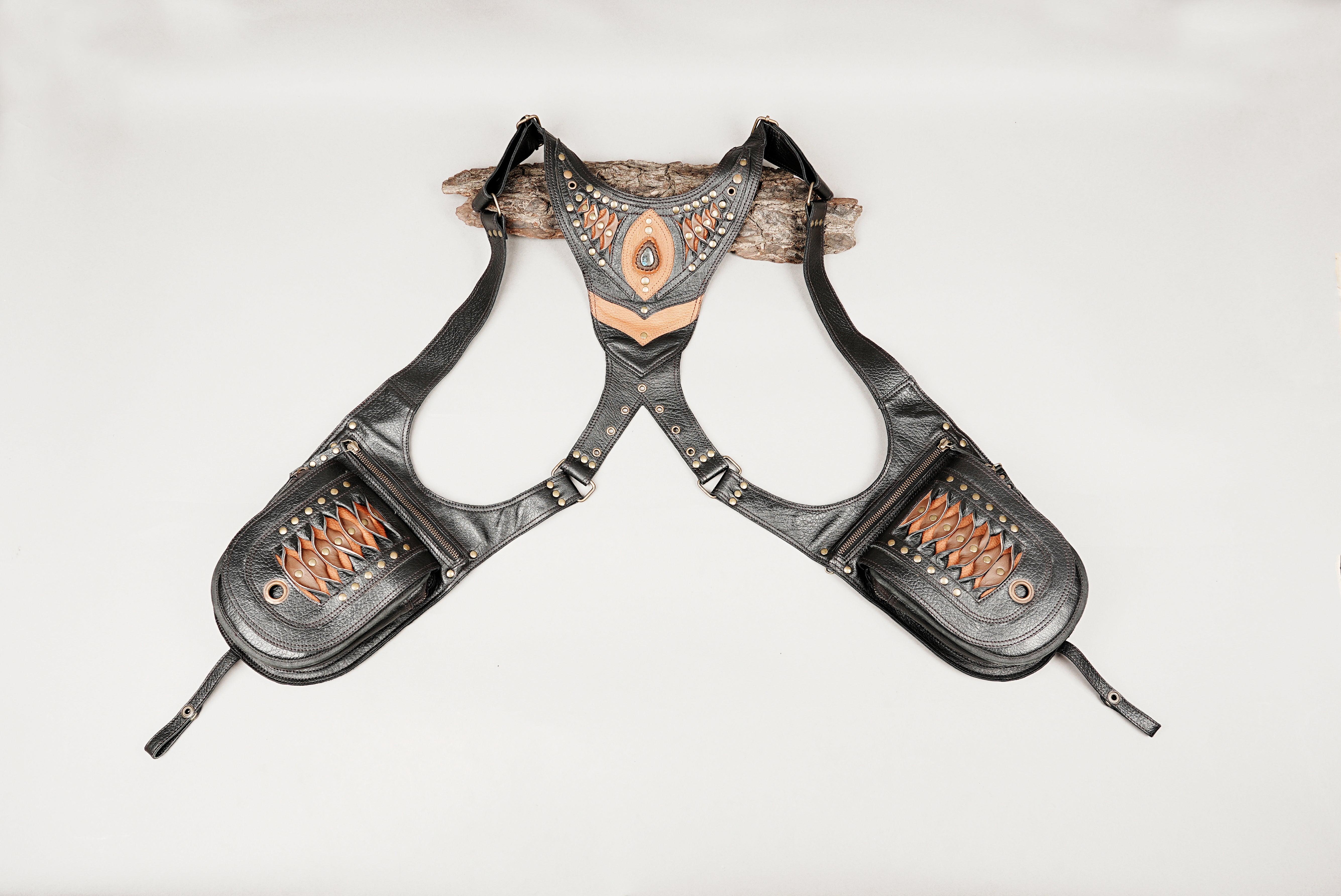 Handmade black leather shoulder holster with dual zipper pouches and gemstone detail