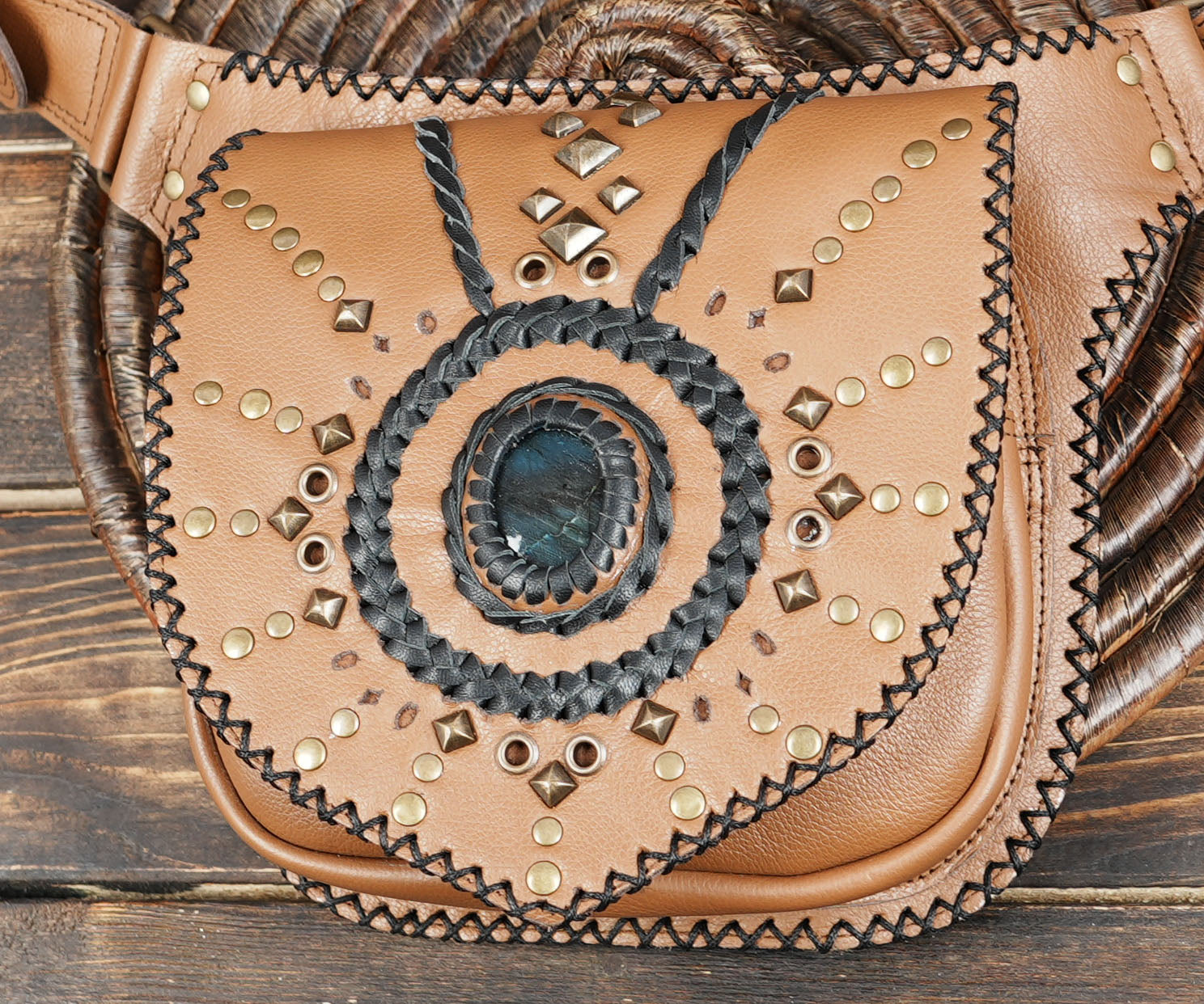 Artisan leather hip bag featuring gemstone and black stitched detailing