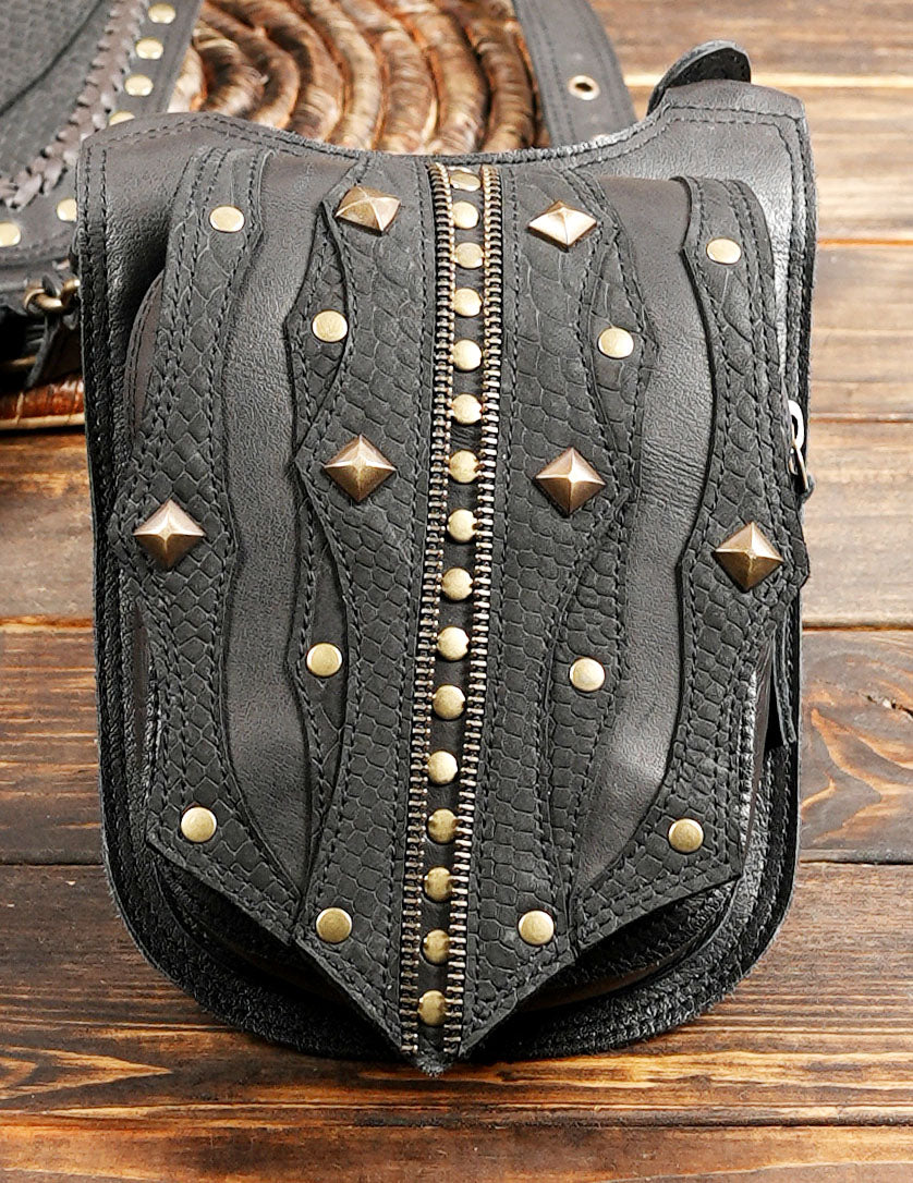 Dual shoulder harness leather bag with metal studs and western design