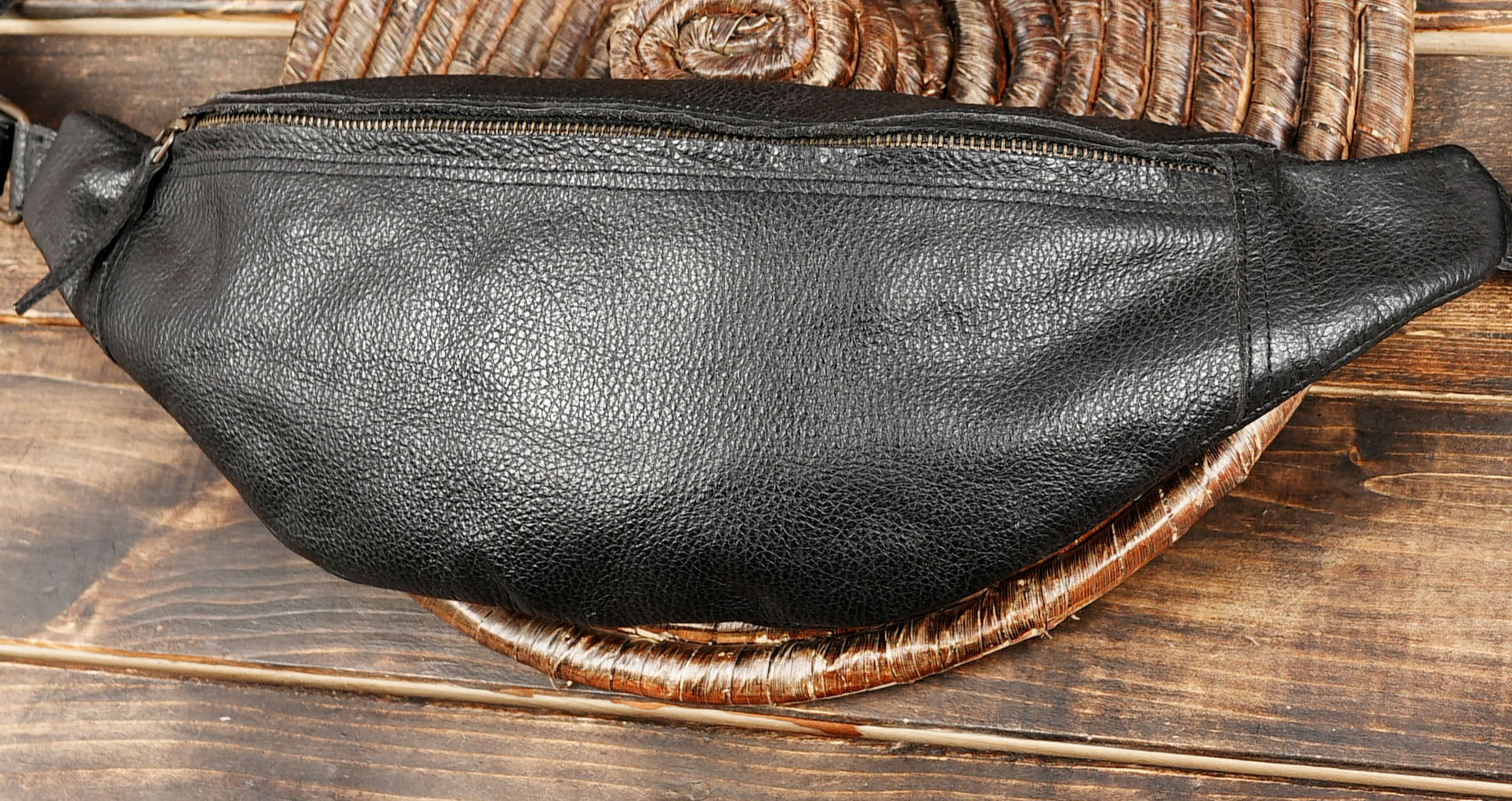 Unisex black leather belt bag for travel and casual wear