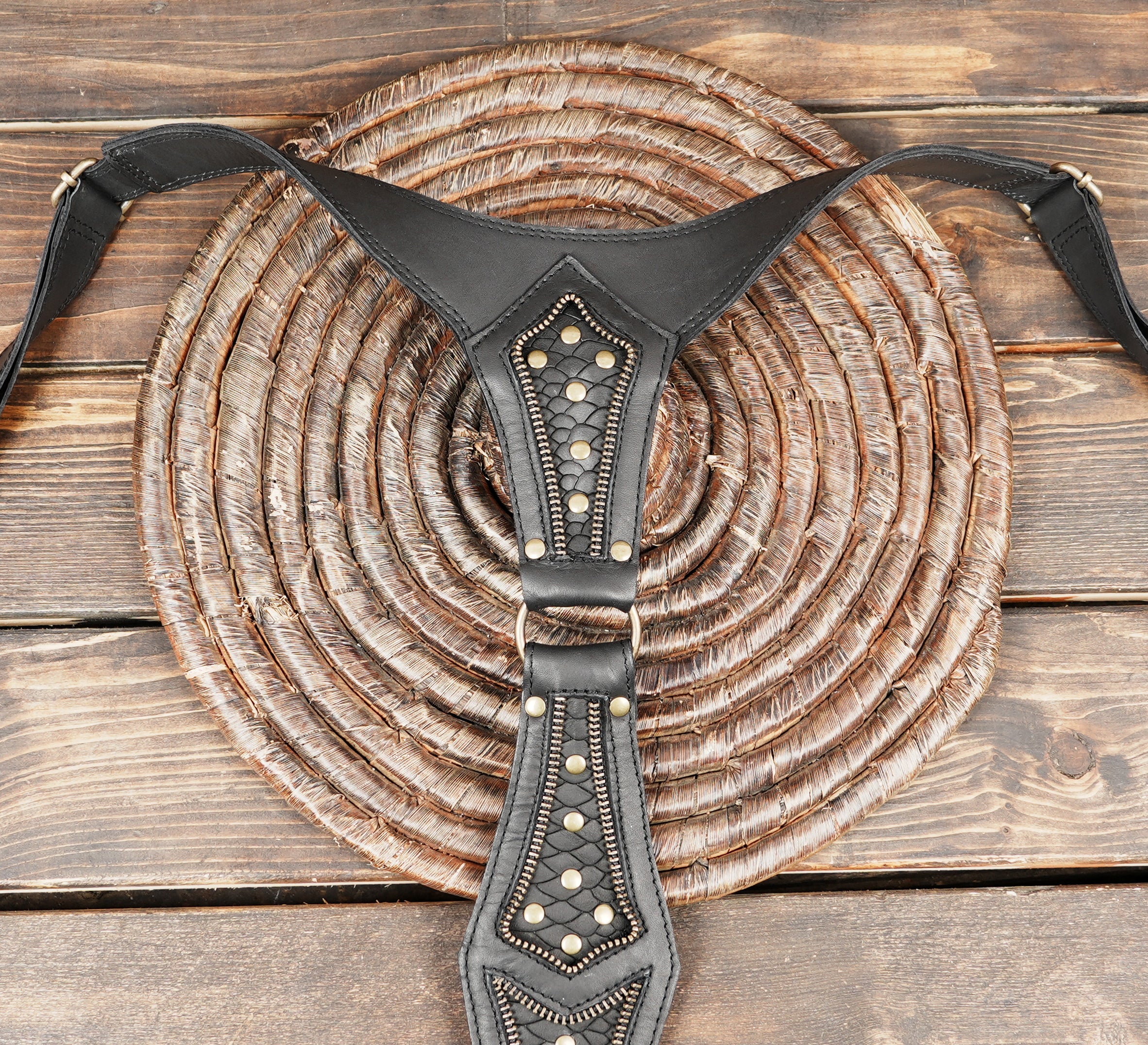 Black festival harness holster with studded detailing and secure pockets