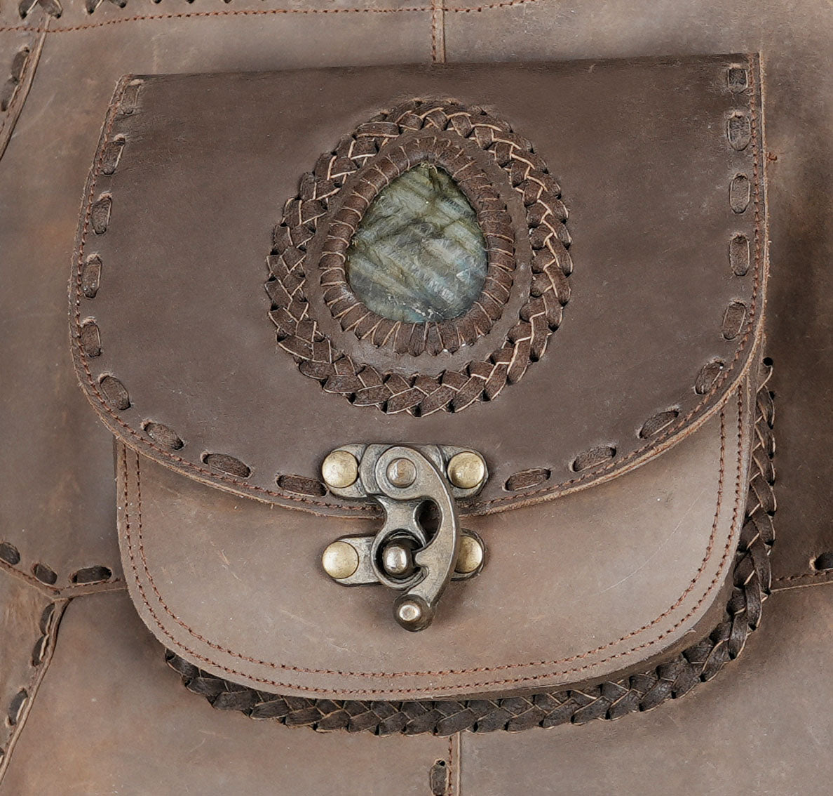 Features a central gemstone pouch for a unique boho look.