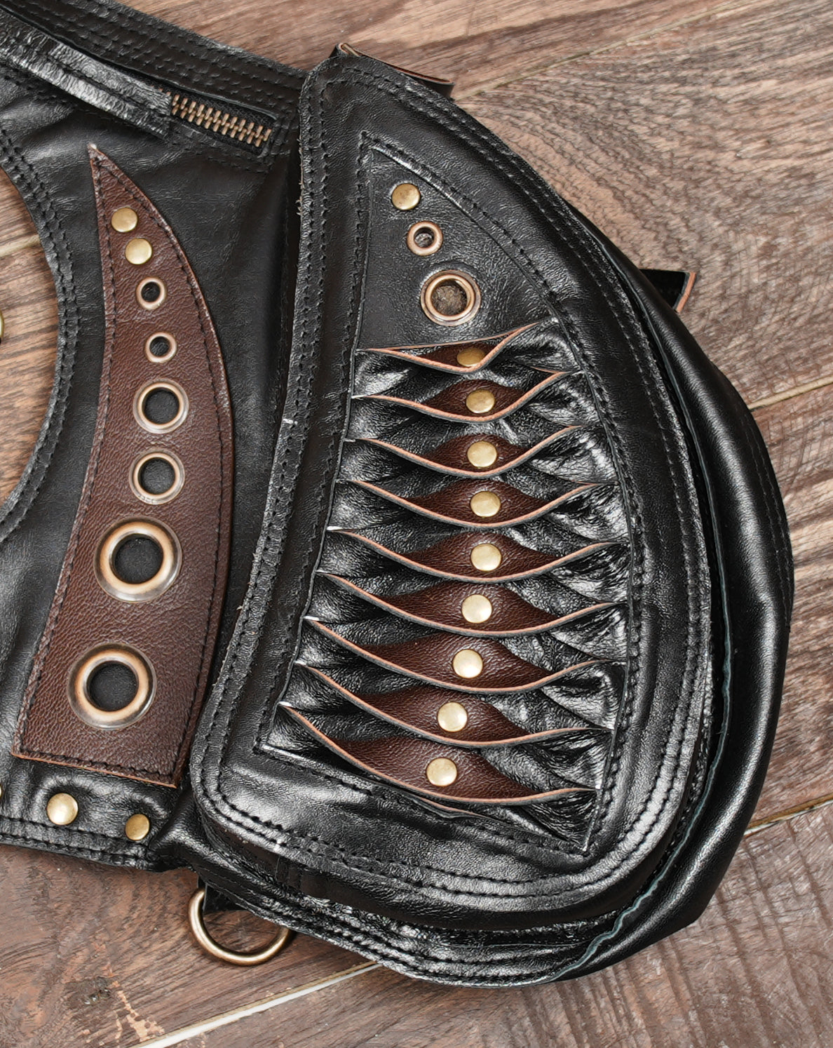 rivets, and dual pouches is a striking piece for festival, gothic, steampunk, cosplay, and Burning Man buyers.