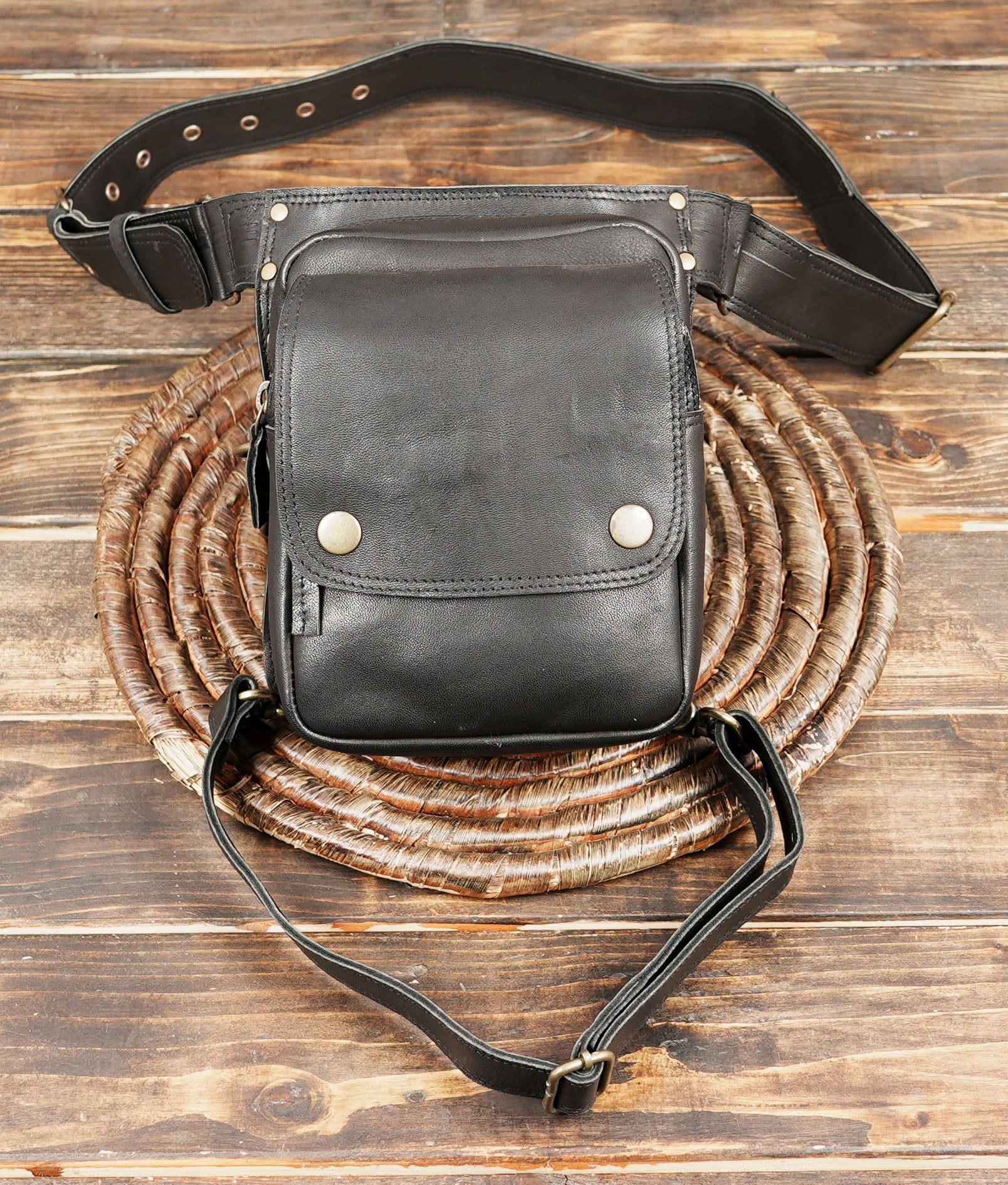 This Handmade Black Leather Waist & Thigh Belt combines timeless craftsmanship with practical design.