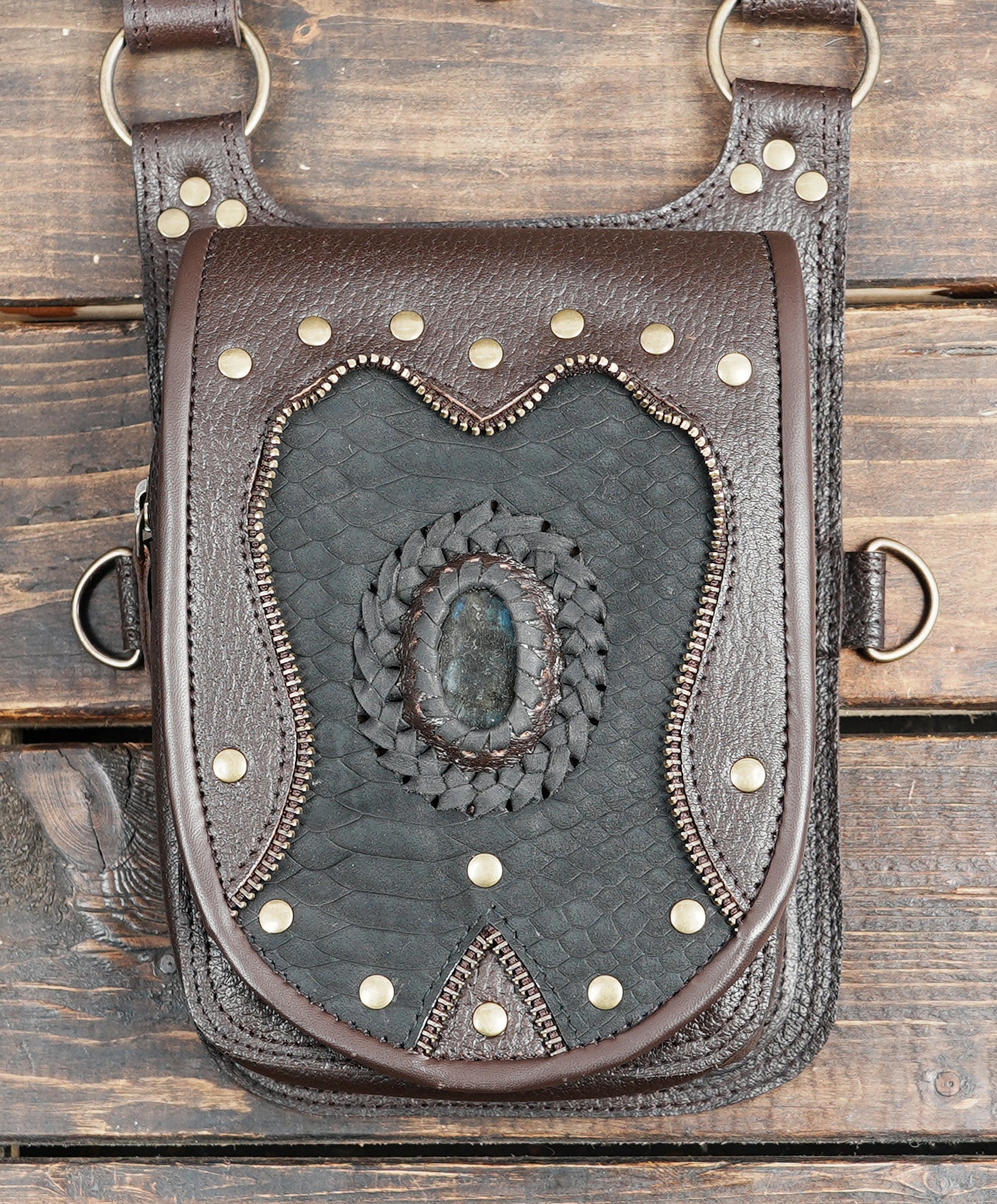 Steampunk style leather holster bag with braided stone inlay design