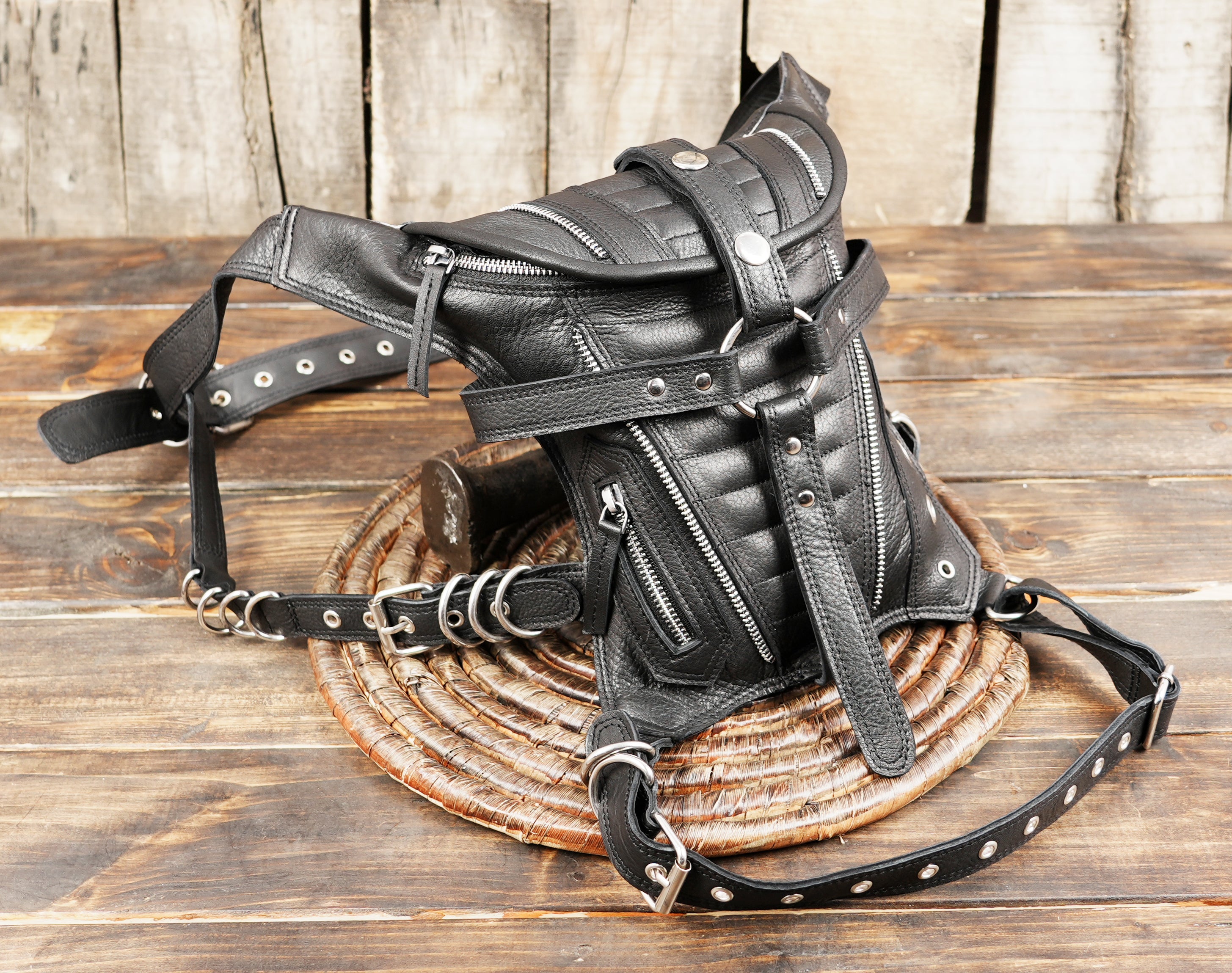 Black leather waist pack with quilted stitching and durable belt strap