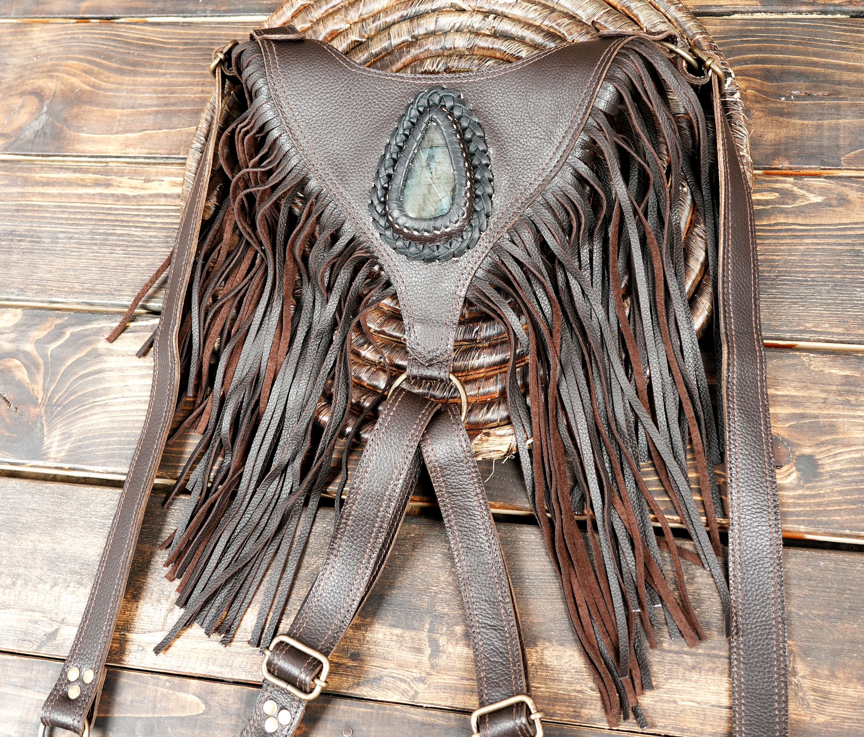 Tribal-inspired leather holster bag with gemstone design