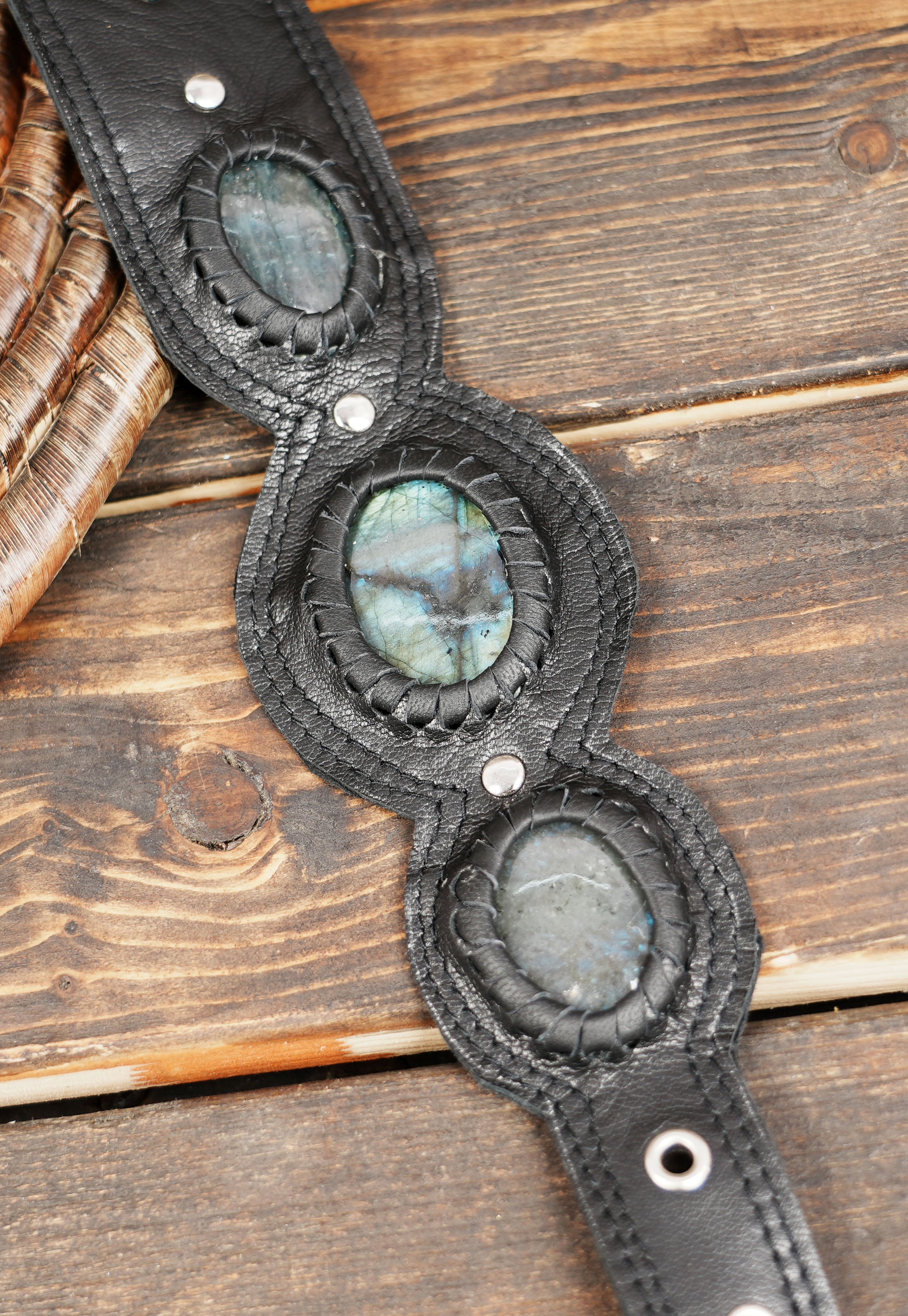 Adjustable gothic leather bag with dual side pouches and gemstone centerpiece