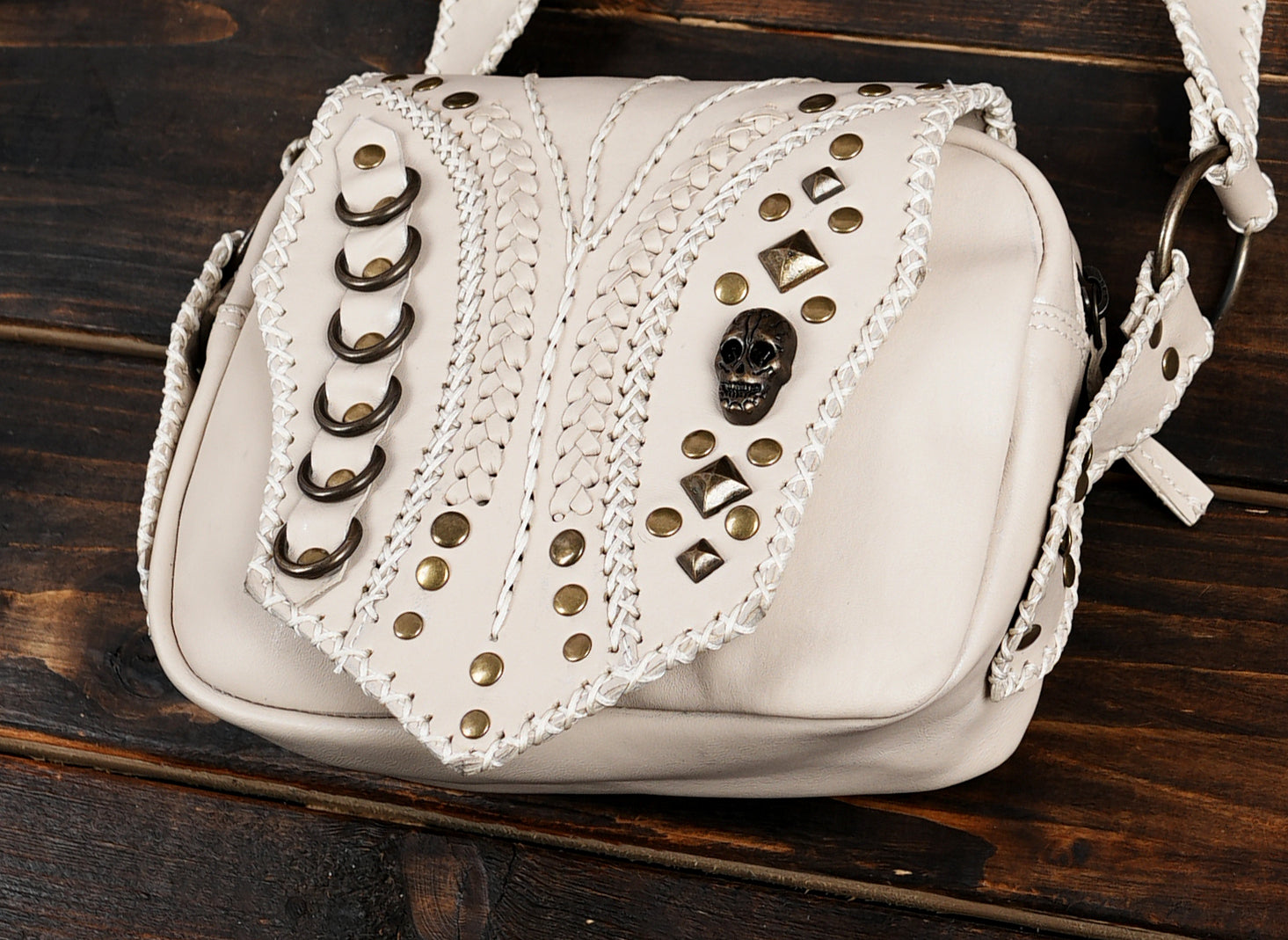 Leather holster bag showing pockets and closure design