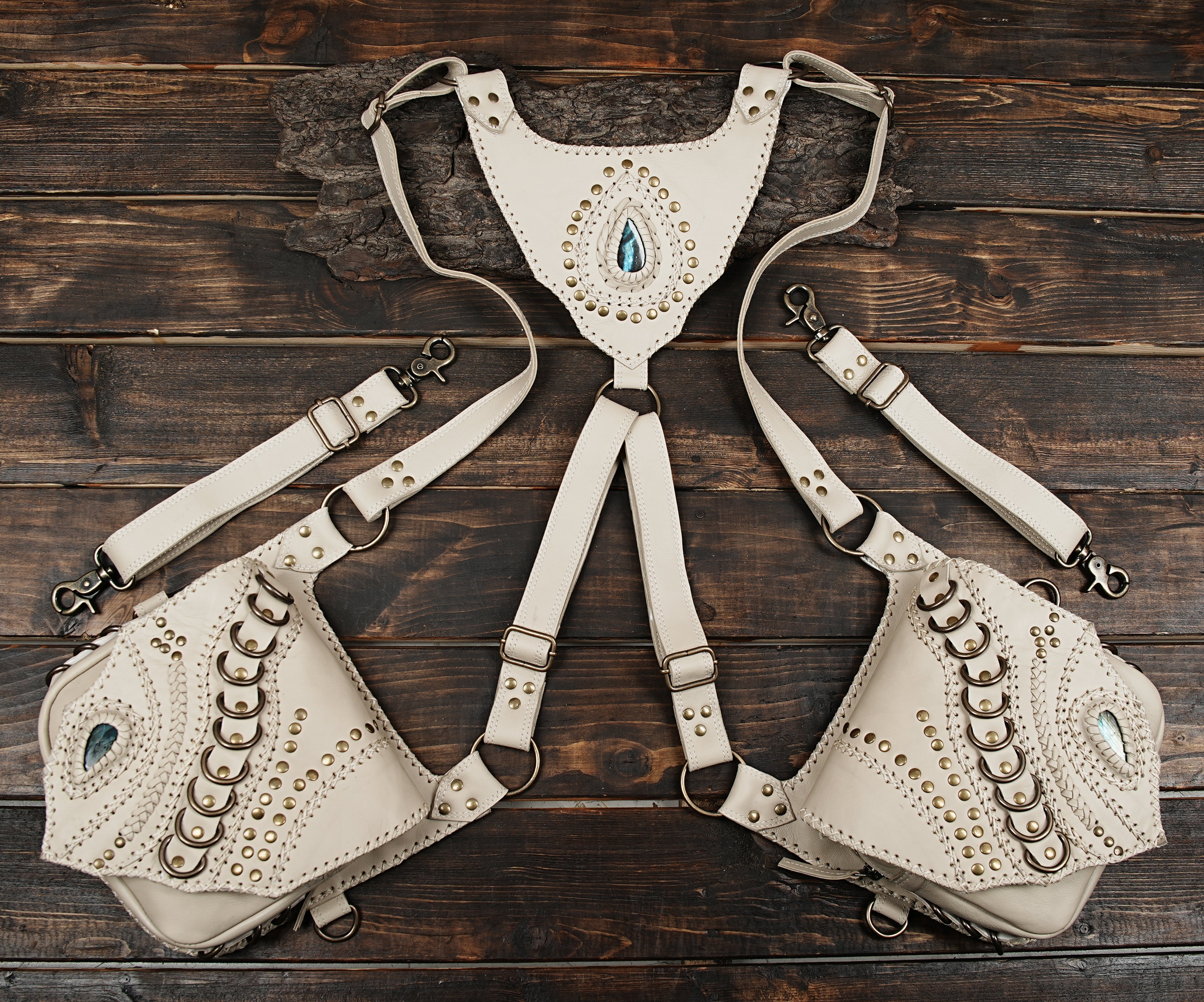 Handcrafted leather harness bag with gemstone and metal rivet detailing