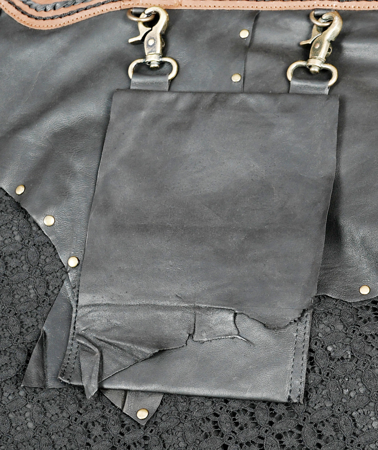 Western handmade leather skirt with lace details and decorative trim