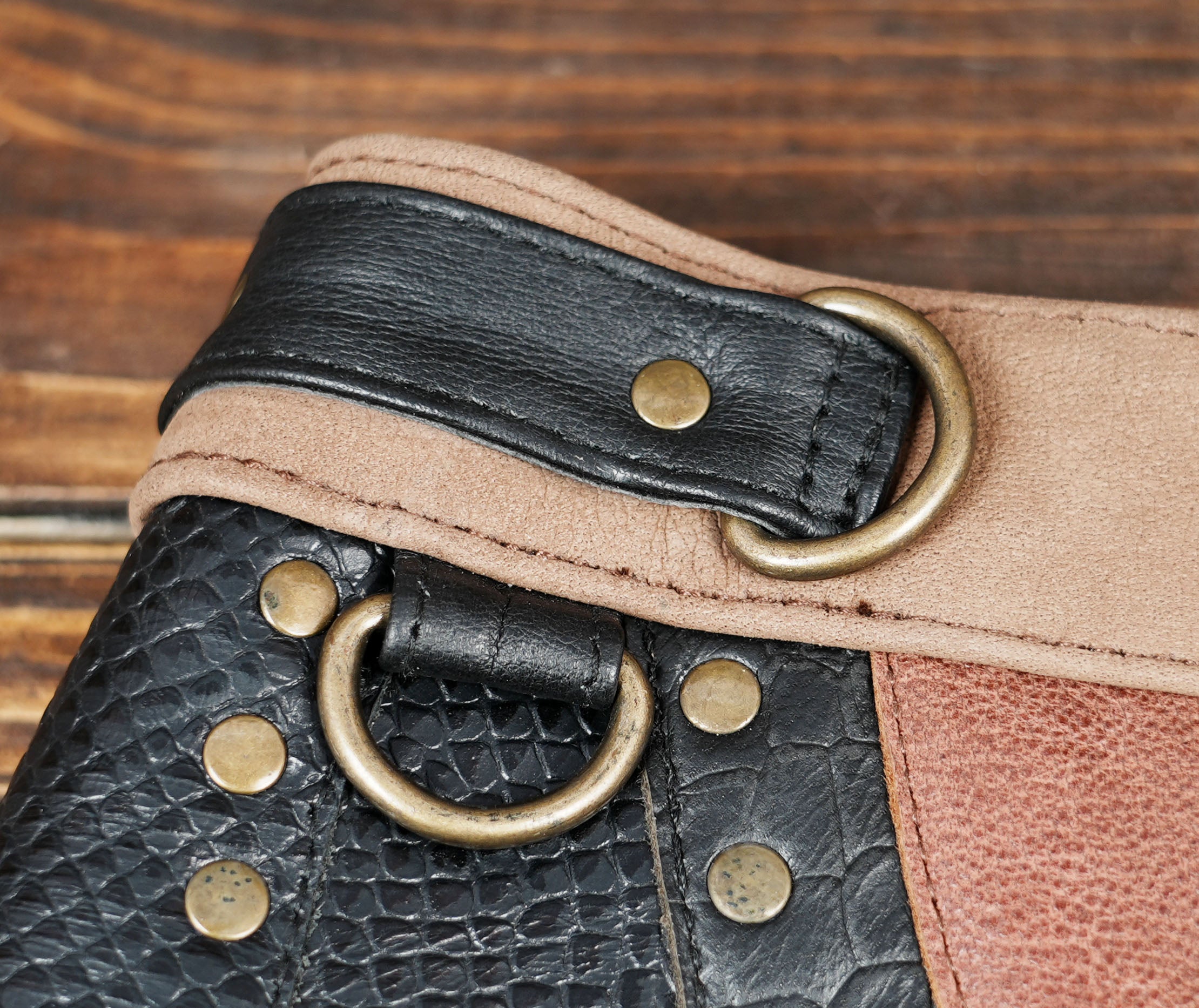 Brown and black patchwork leather skirt with gemstone ornament