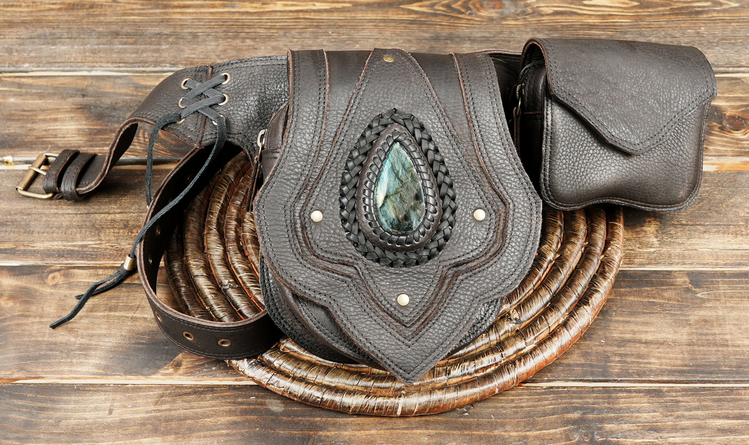 boho-inspired leather hip bag with braided detailing and stone accent