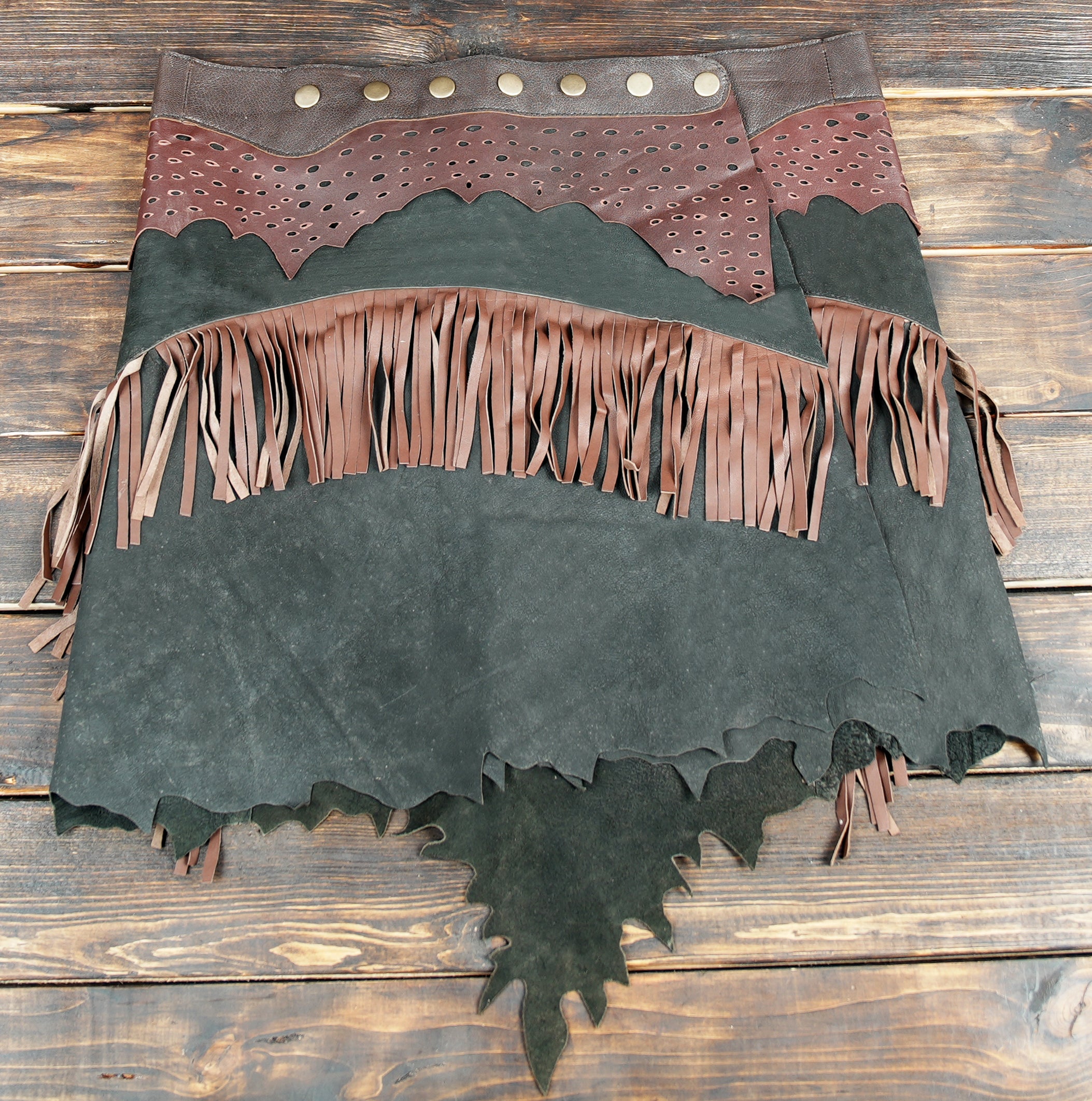Western cowgirl leather skirt with layered fringe and rustic design