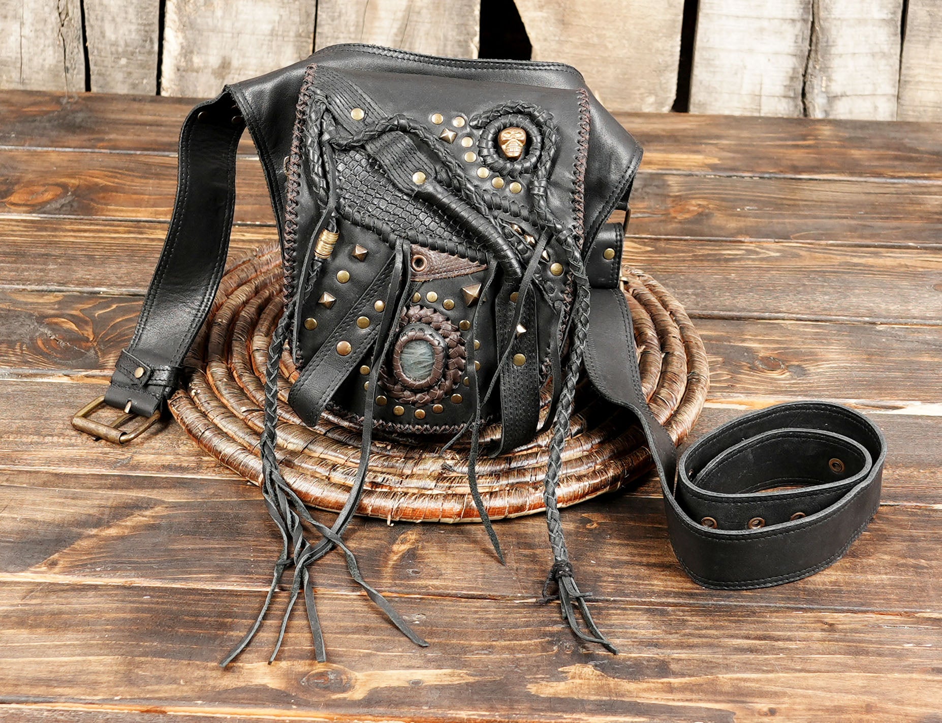 Tribal-inspired leather waist pouch with metal studs