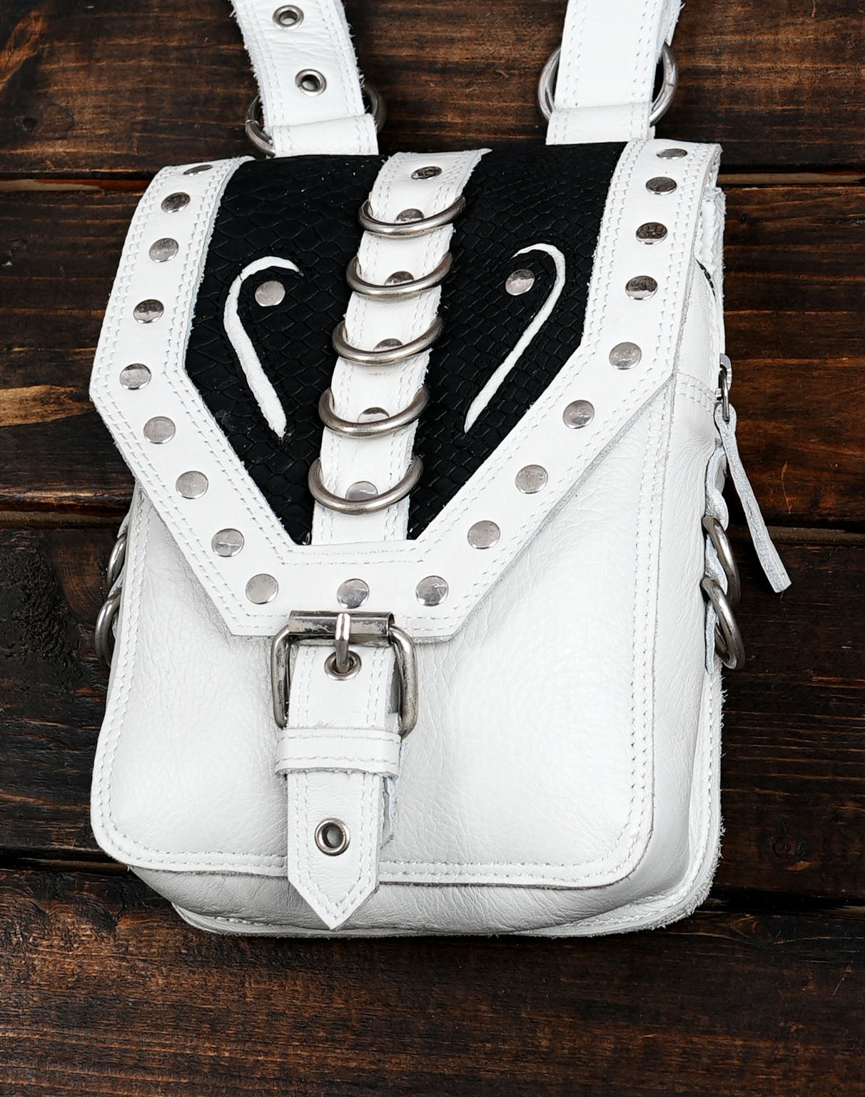 This Handmade White & Black Leather Holster Belt is a bold and unique accessory crafted for those who love to combine fashion with functionality.
