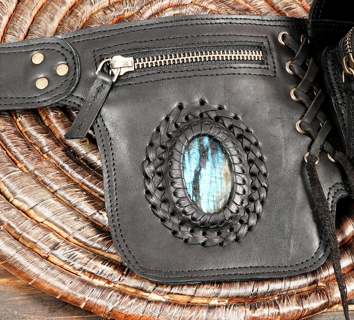 Close-up of labradorite gemstone on handmade leather belt