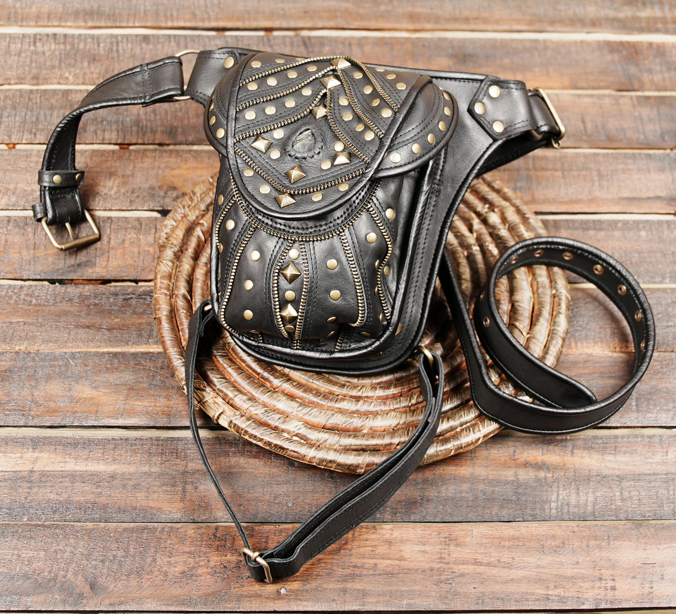 unisex black leather holster bag with steampunk-inspired hardware