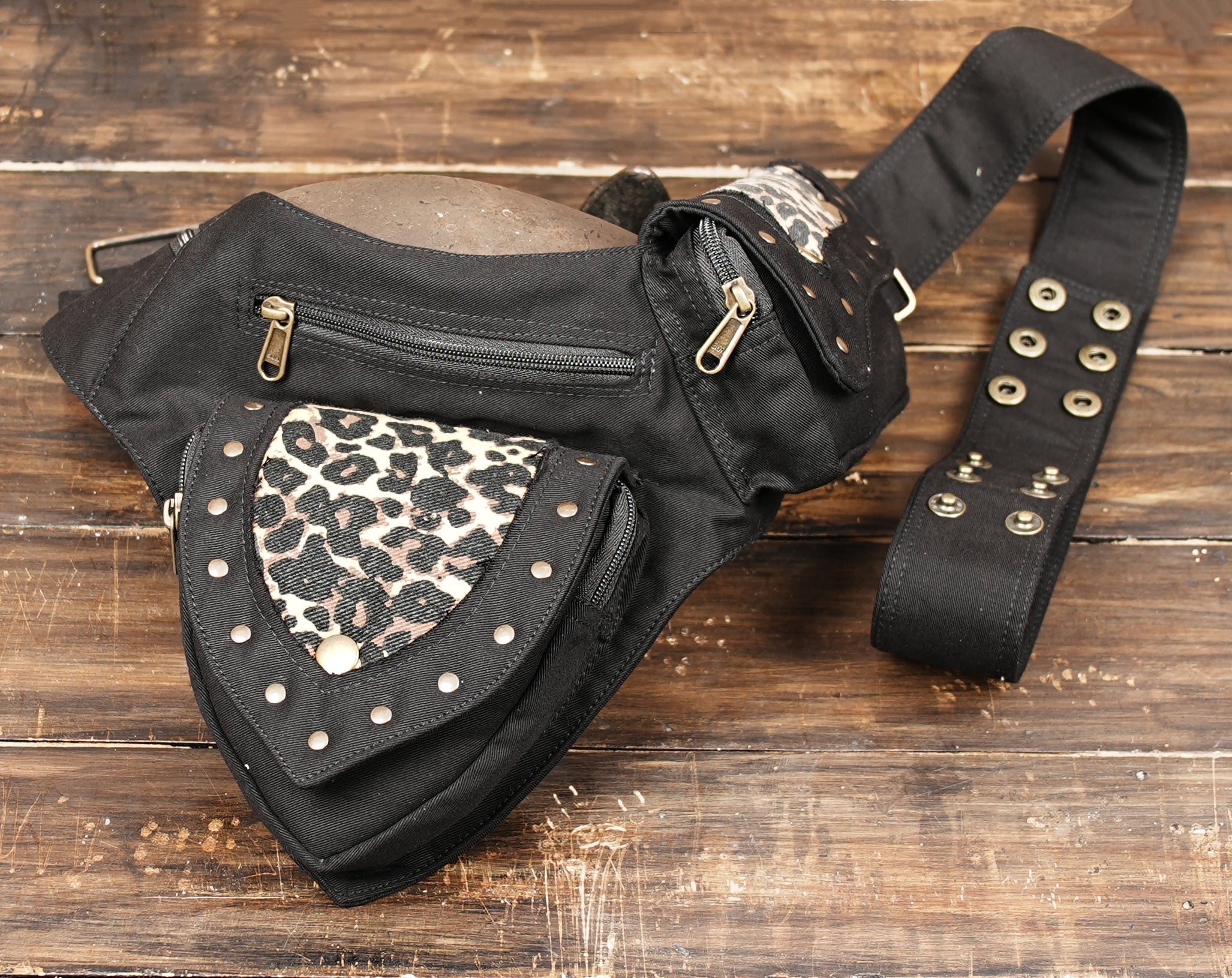 Leopard print waist bag worn by male mannequin