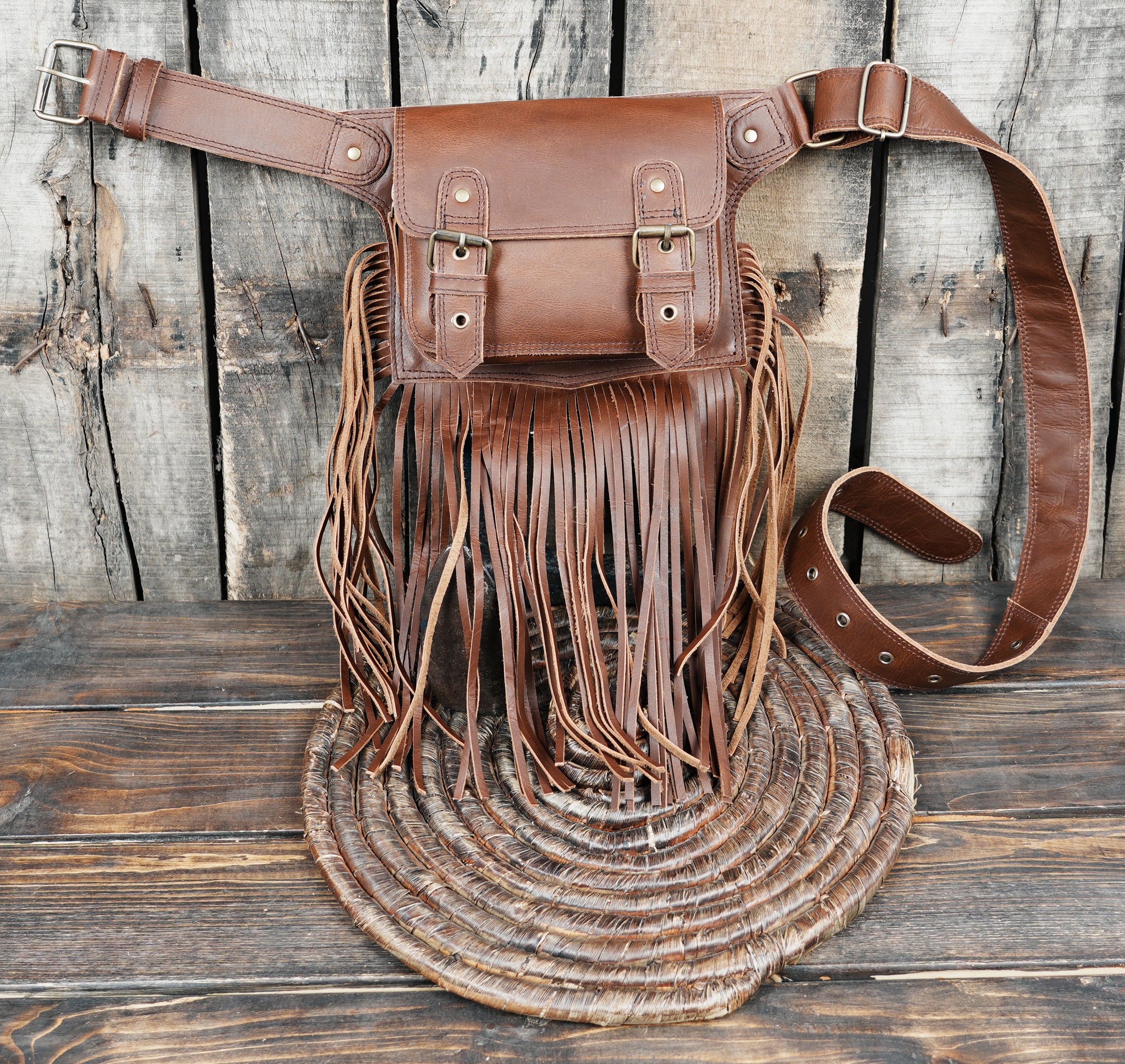 Travel friendly leather belt bag with western fringe design