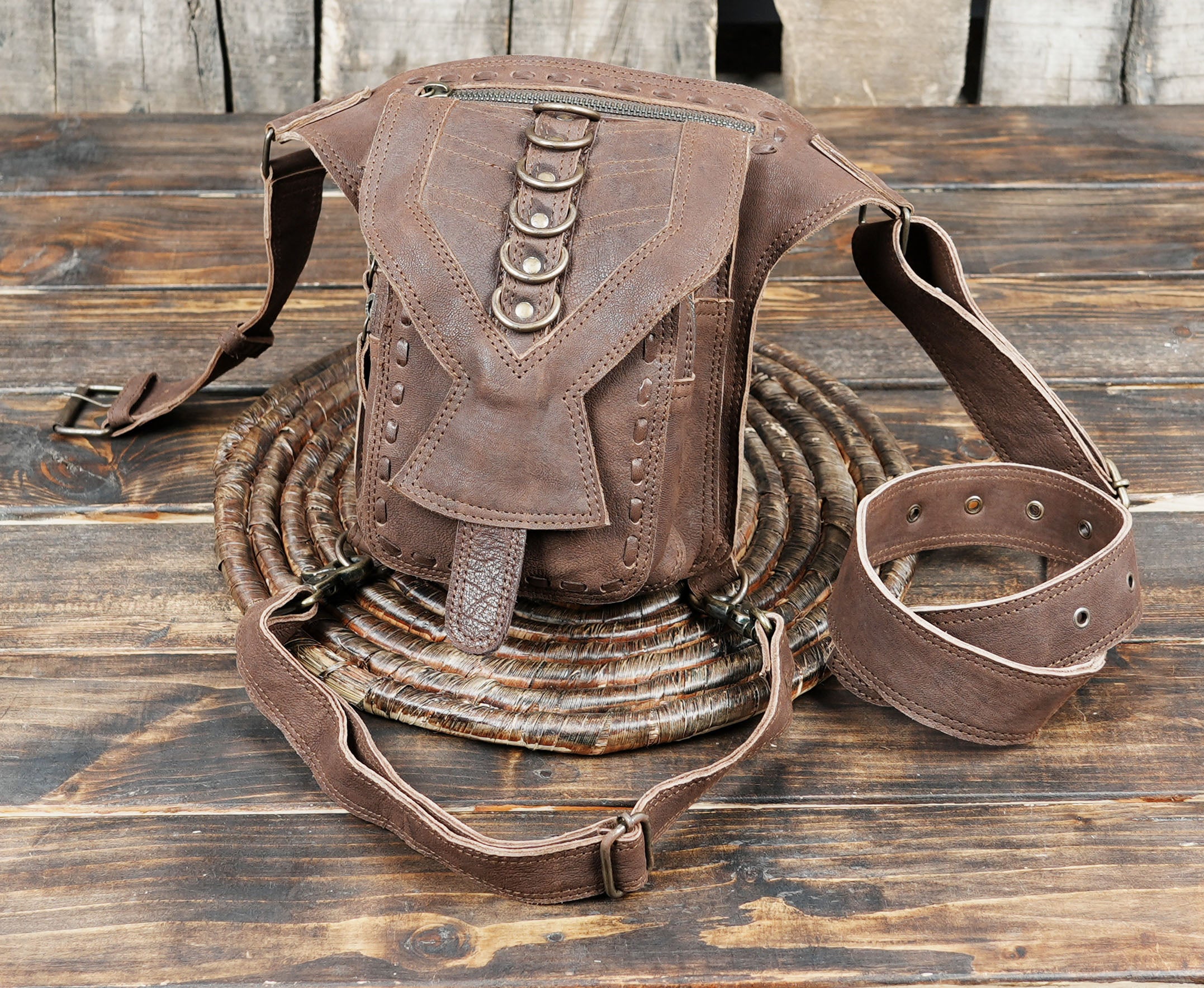 Made from premium genuine leather, it features an adjustable waist strap and thigh strap, ensuring a comfortable and secure fit.