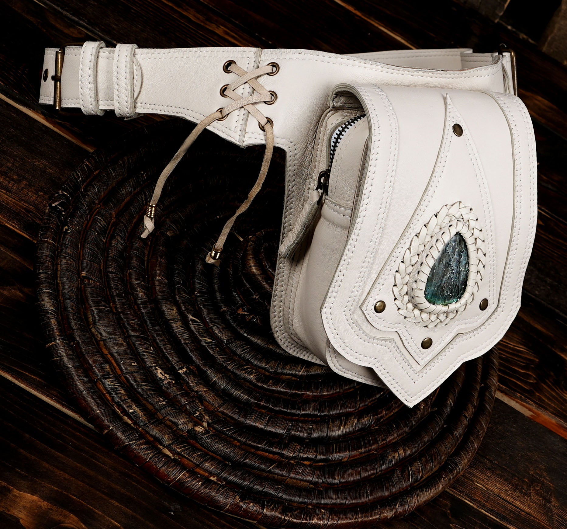 White leather fanny pack with brass studs and gemstone