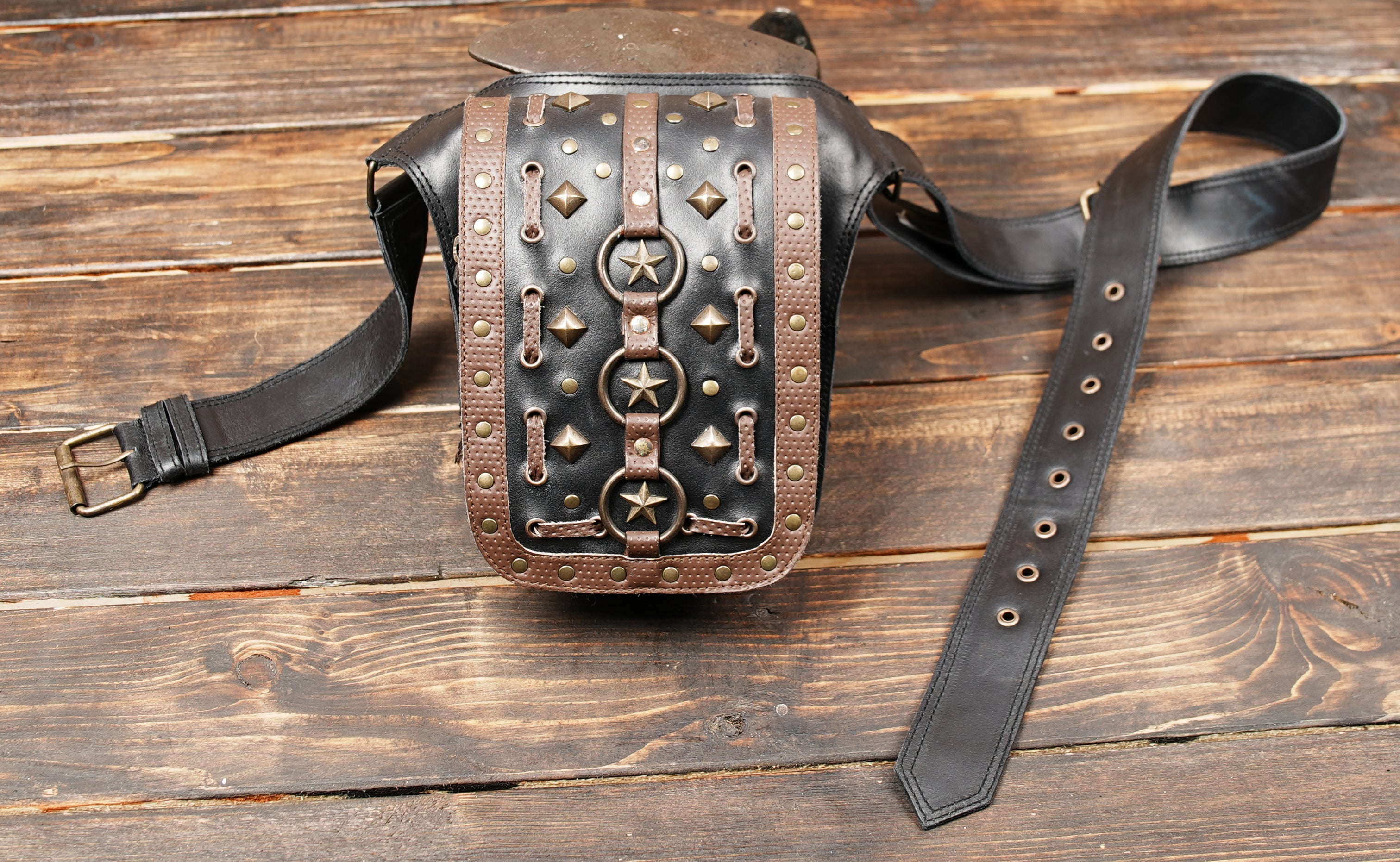 Back side of black leather utility belt bag with zipper pocket