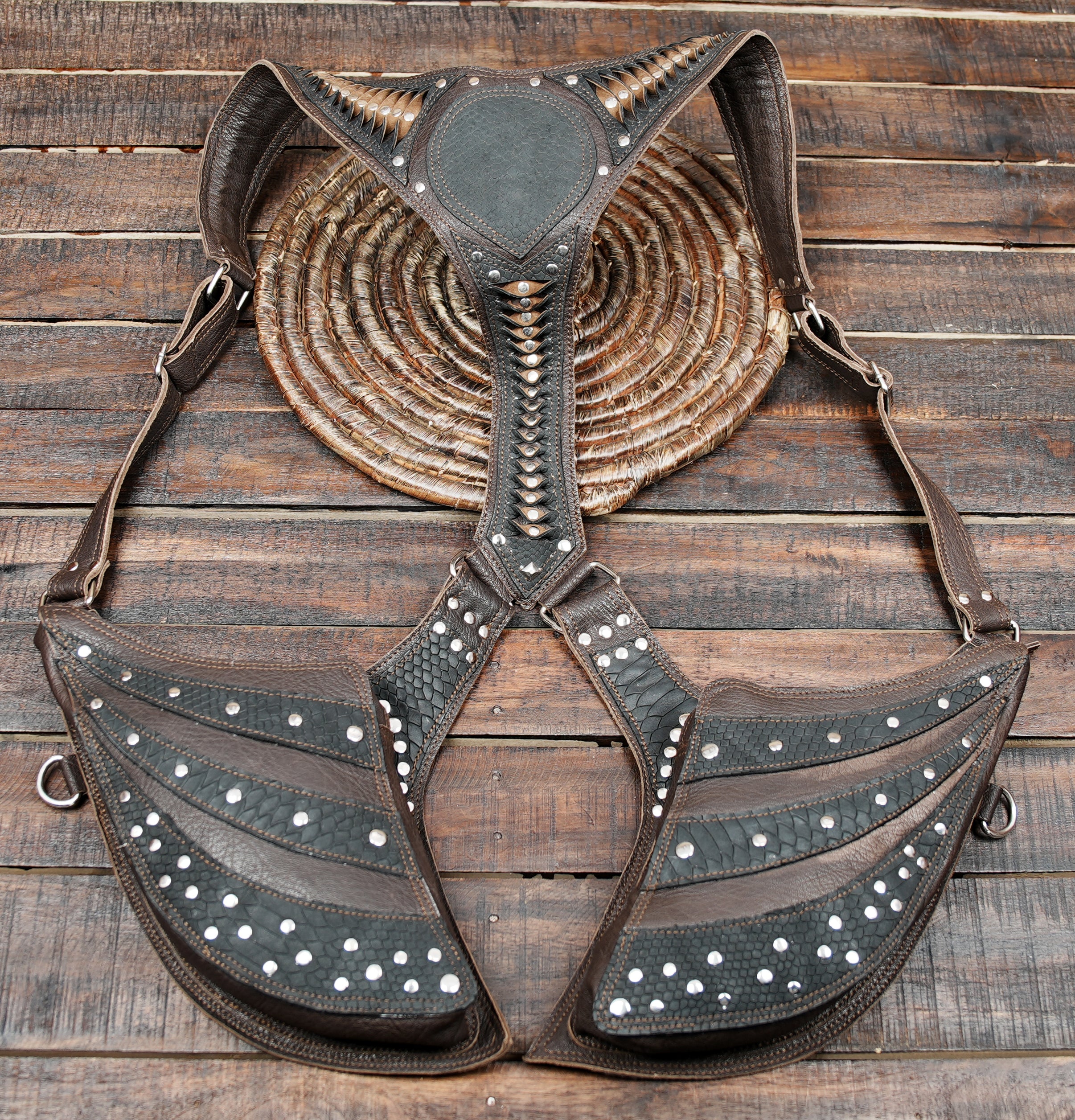 designed for people who love unique statement accessories. Crafted from genuine brown and black leather,