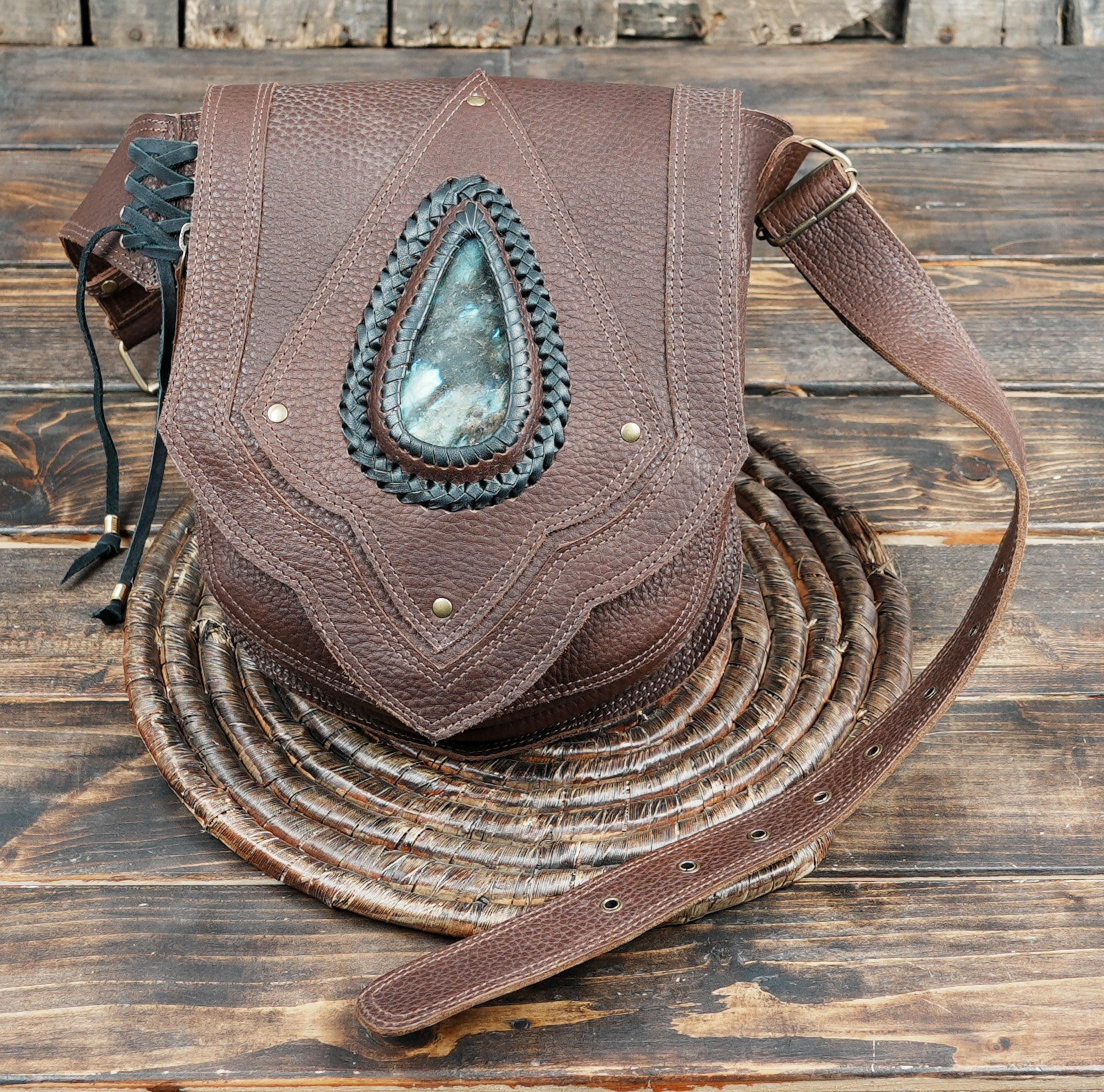 Tribal inspired leather belt pouch with textured grain finish and lace side detail