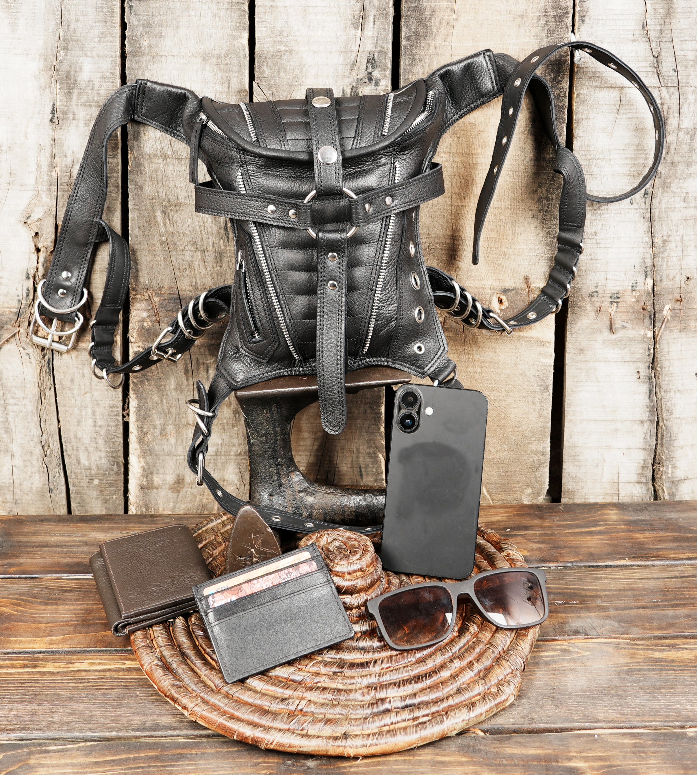 Steampunk-inspired black leather utility bag for men and women.